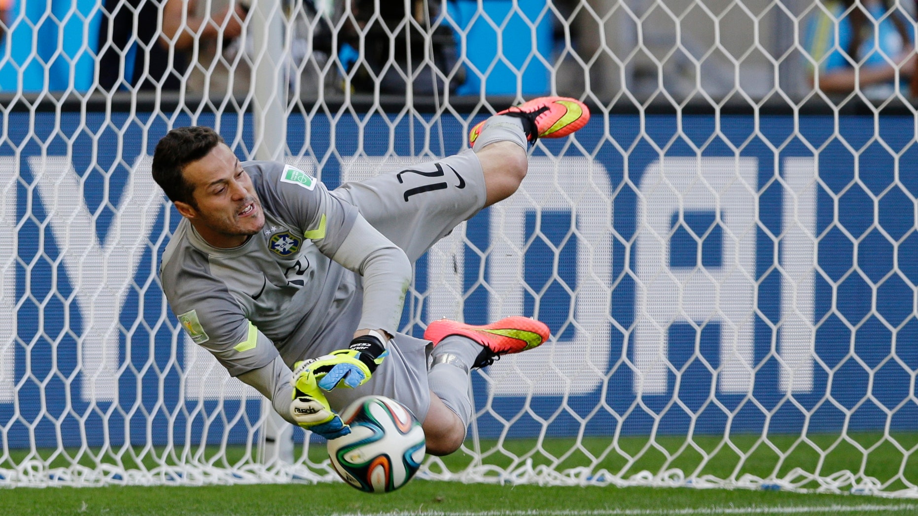 June 28, 2014 - Brazil's goalkeeper Julio Cesar makes a save during a penalty shootout during the World Cup match between Brazil and Chile, Mineirao Stadium in Belo Horizonte, Brazil.
