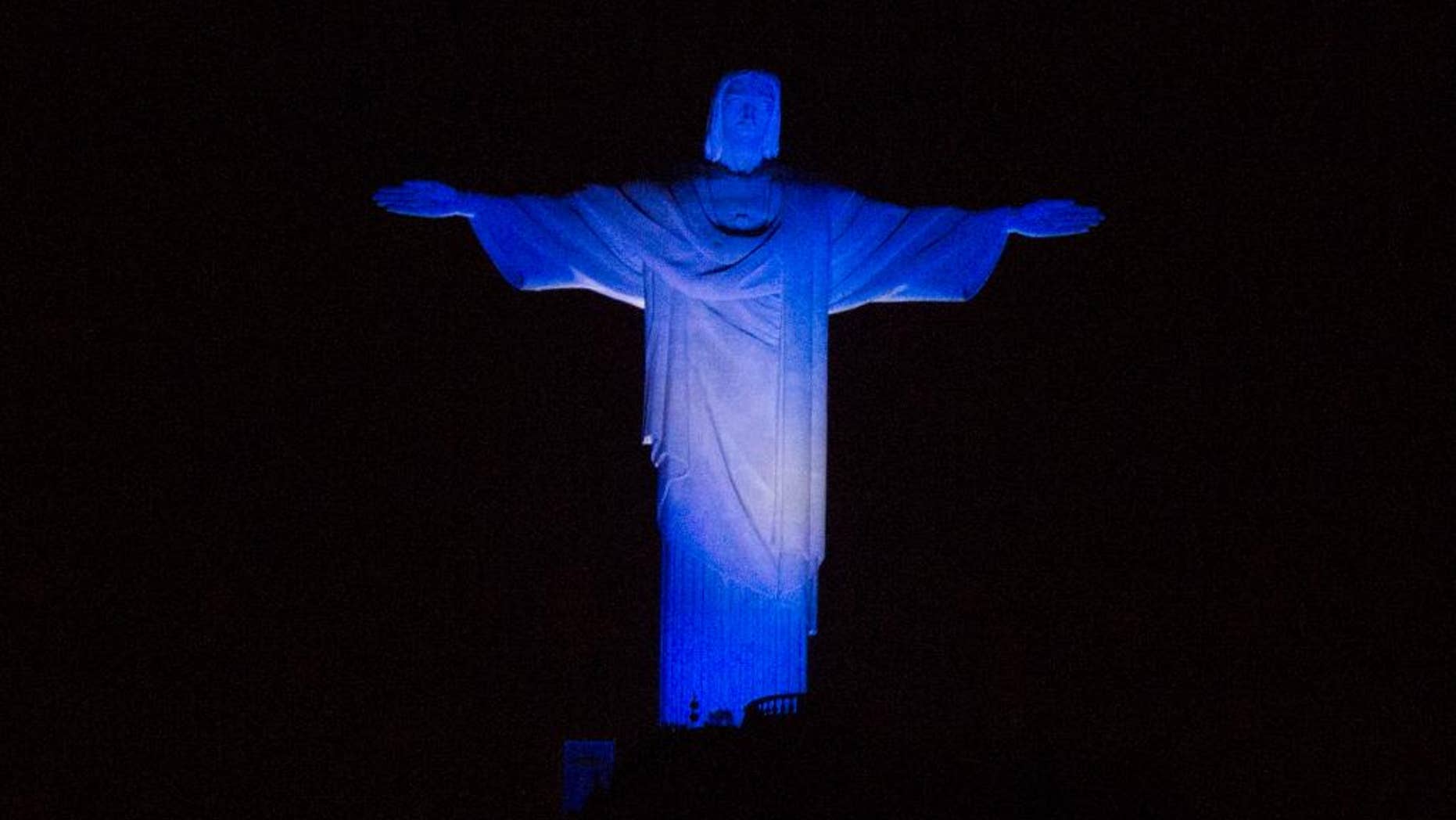Christ the Redeemer statue is lit with the Argentina team's colors as part of soccer the World Cup, in Rio de Janeiro, Brazil, Saturday, July 12, 2014. Argentina will face Germany for the final match of the world tournament. (AP Photo/Leo Correa)