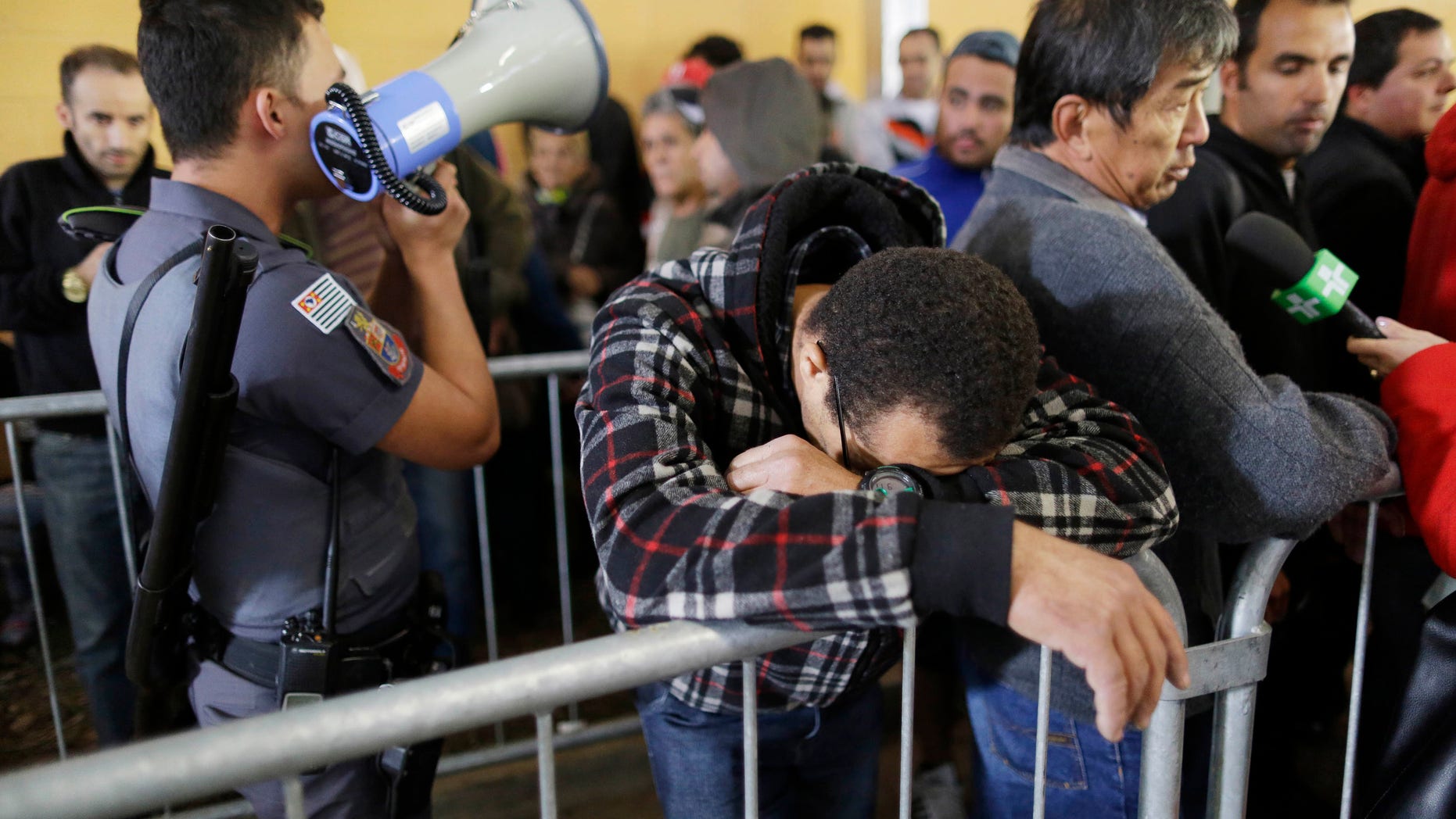 Soccer fan reacts after learning that tickets for some of Brazil's World Cup soccer games are sold-out.