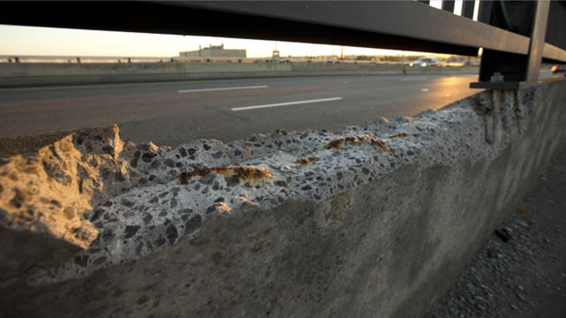 September 4, 2013: Cracked concrete exposes parts of reinforcement bars on the Frederick Douglass Memorial Bridge which spans the Anacostia River in Washington.