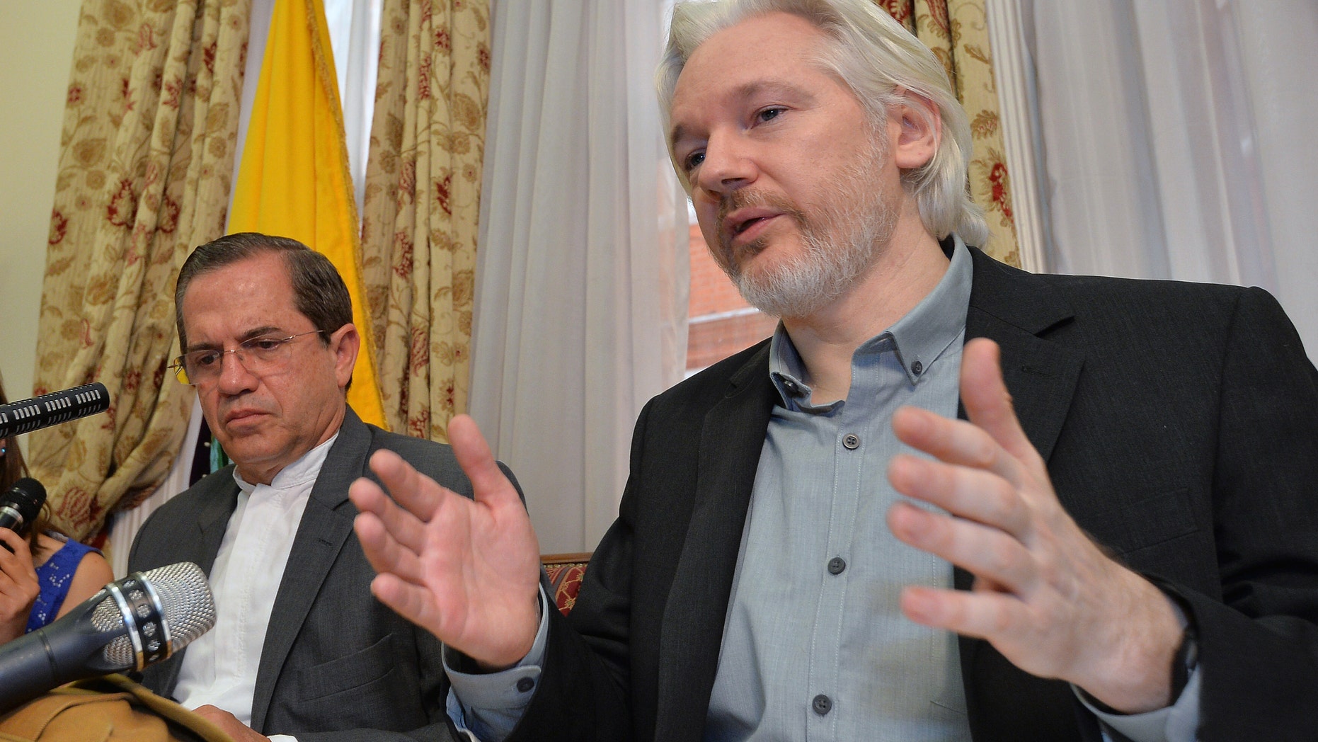 Aug. 18, 2014 - Ecuador's Foreign Minister Ricardo Patino, left, and WikiLeaks founder Julian Assange at a press conference at the Ecuadorian Embassy in London. Assange confirmed he'll be "leaving the embassy soon." The Australian Assange fled to the embassy in 2012 to escape extradition to Sweden, where he's wanted for sex crimes.