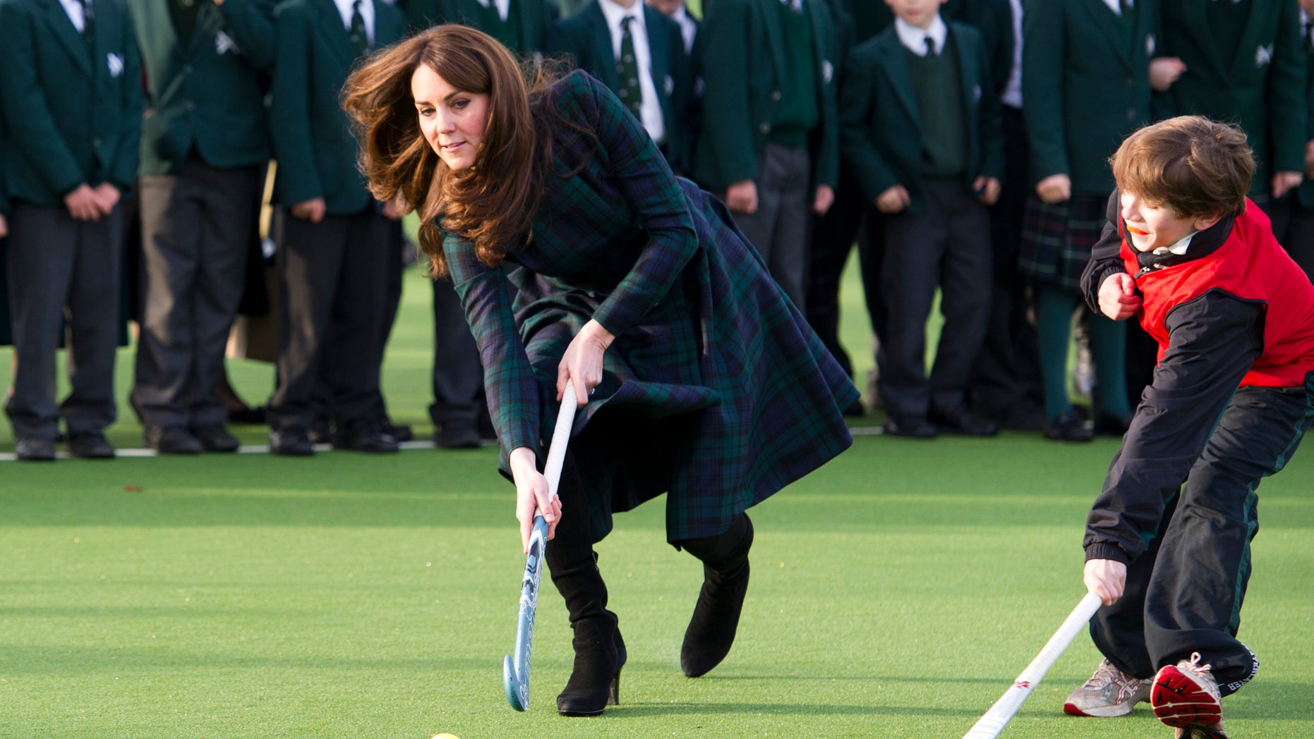 Nov. 30, 2012 - Kate, the Duchess of Cambridge plays hockey during her visit to St. Andrews School in Pangbourne, England.