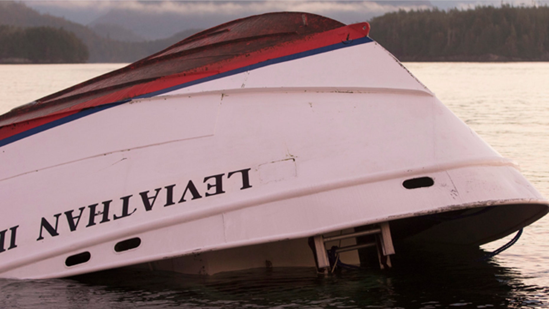 Oct. 27, 2015: The bow of the Leviathan II, a whale-watching boat that capsized on Sunday, is seen near Vargas Island after it was towed it from where it sank to a protected spot behind an island, before it is towed ashore for inspection. (Chad Hipolito/The Canadian Press via AP)