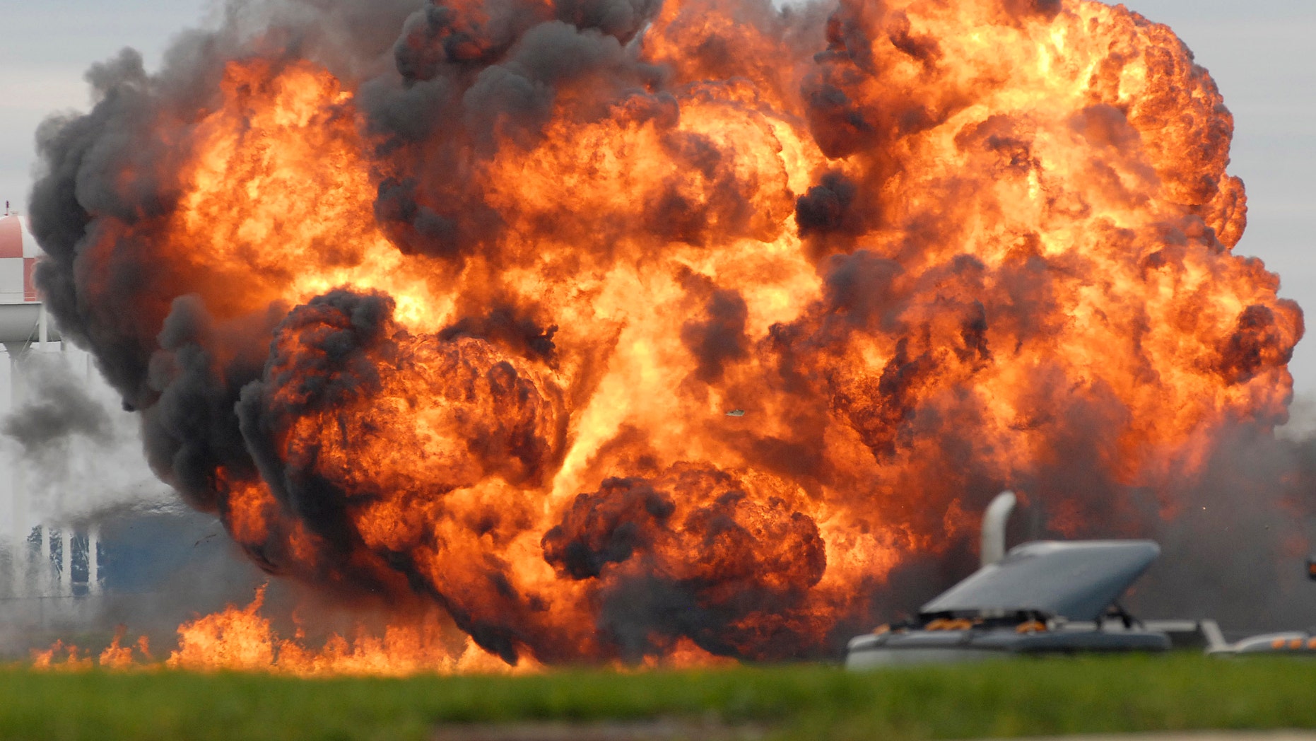 A single engine T-28 from the six-plane Trojan Horsemen Demonstration Flight Team crashes and explodes during a performance at the Thunder Over the Blue Ridge Open House and Air Show, Saturday, Sept. 17, 2011 at the 167th Airlift Wing in Martinsburg, W.Va.