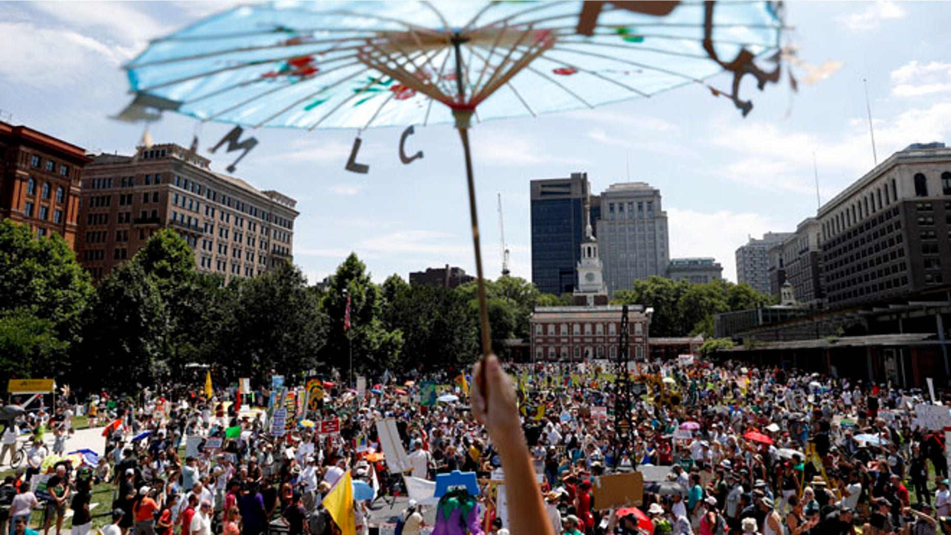 Protesters gather during a demonstration at Liberty Square on Sunday, July 24, 2016, in Philadelphia.