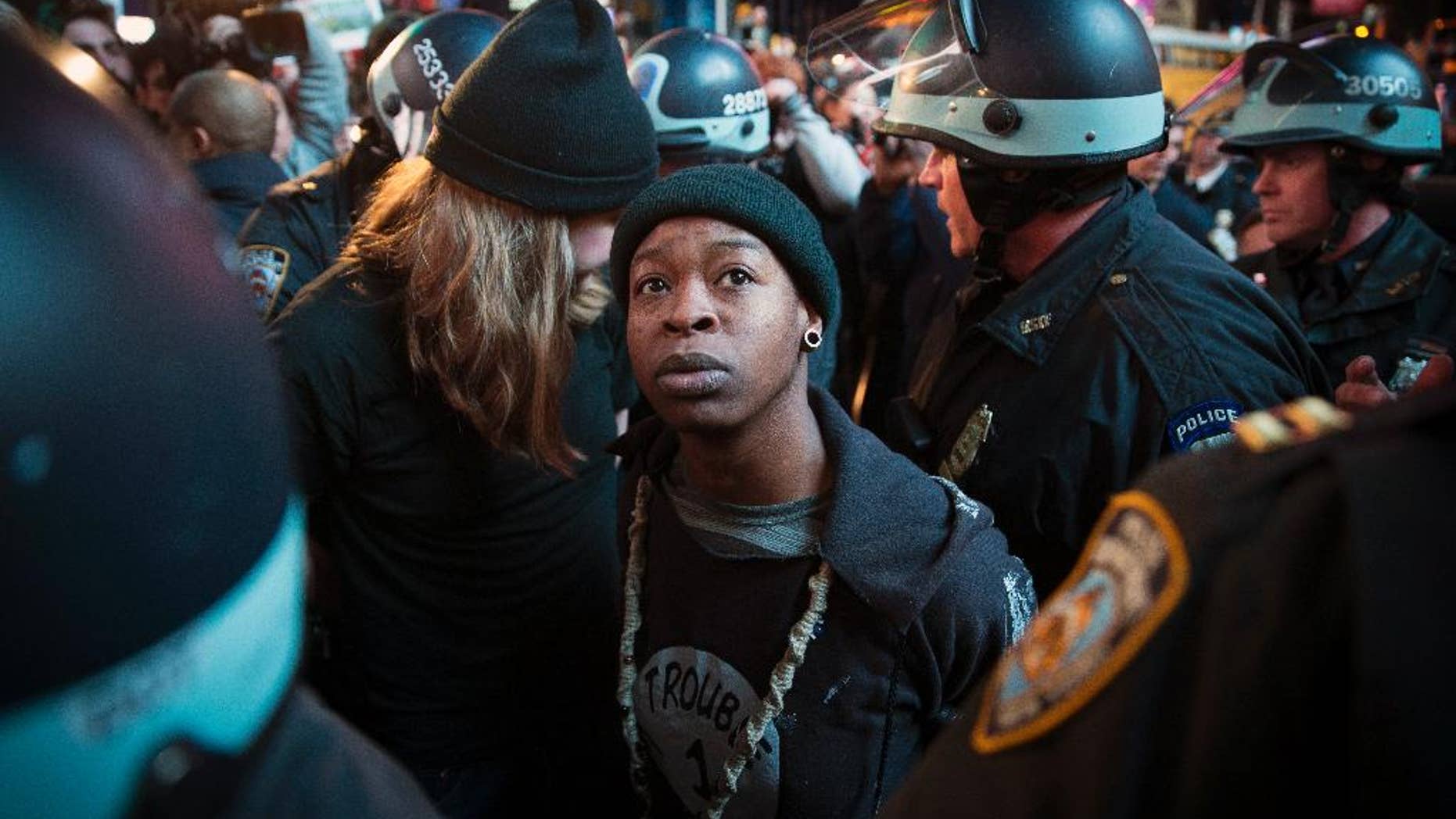 A demonstrator is arrested on Tuesday, Nov. 25, 2014, in New York.