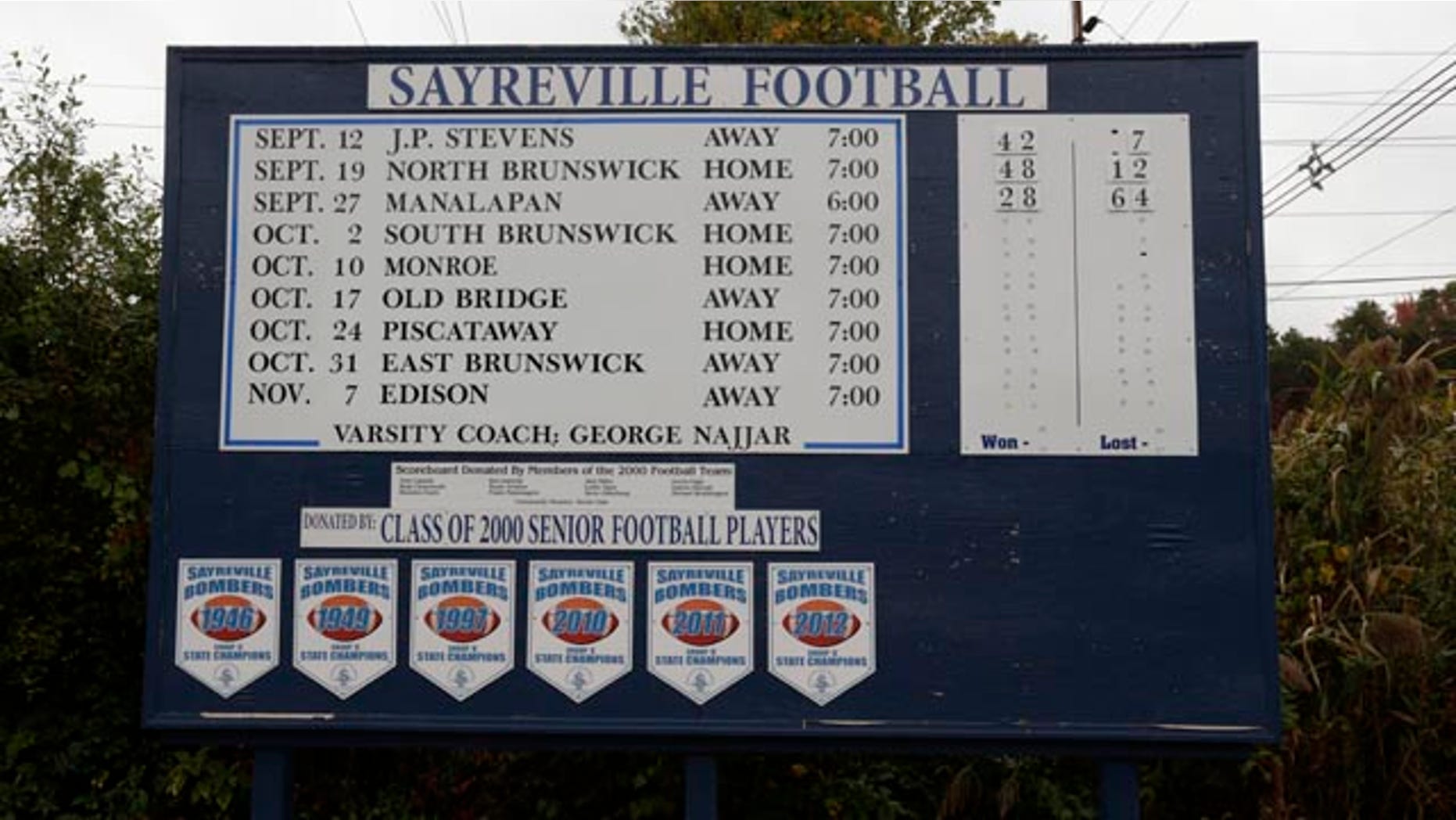October 11, 2014: A roadside sign displays the Sayreville War Memorial High School football team schedule on Main Street in Sayreville, N.J. (AP Photo/Julio Cortez)