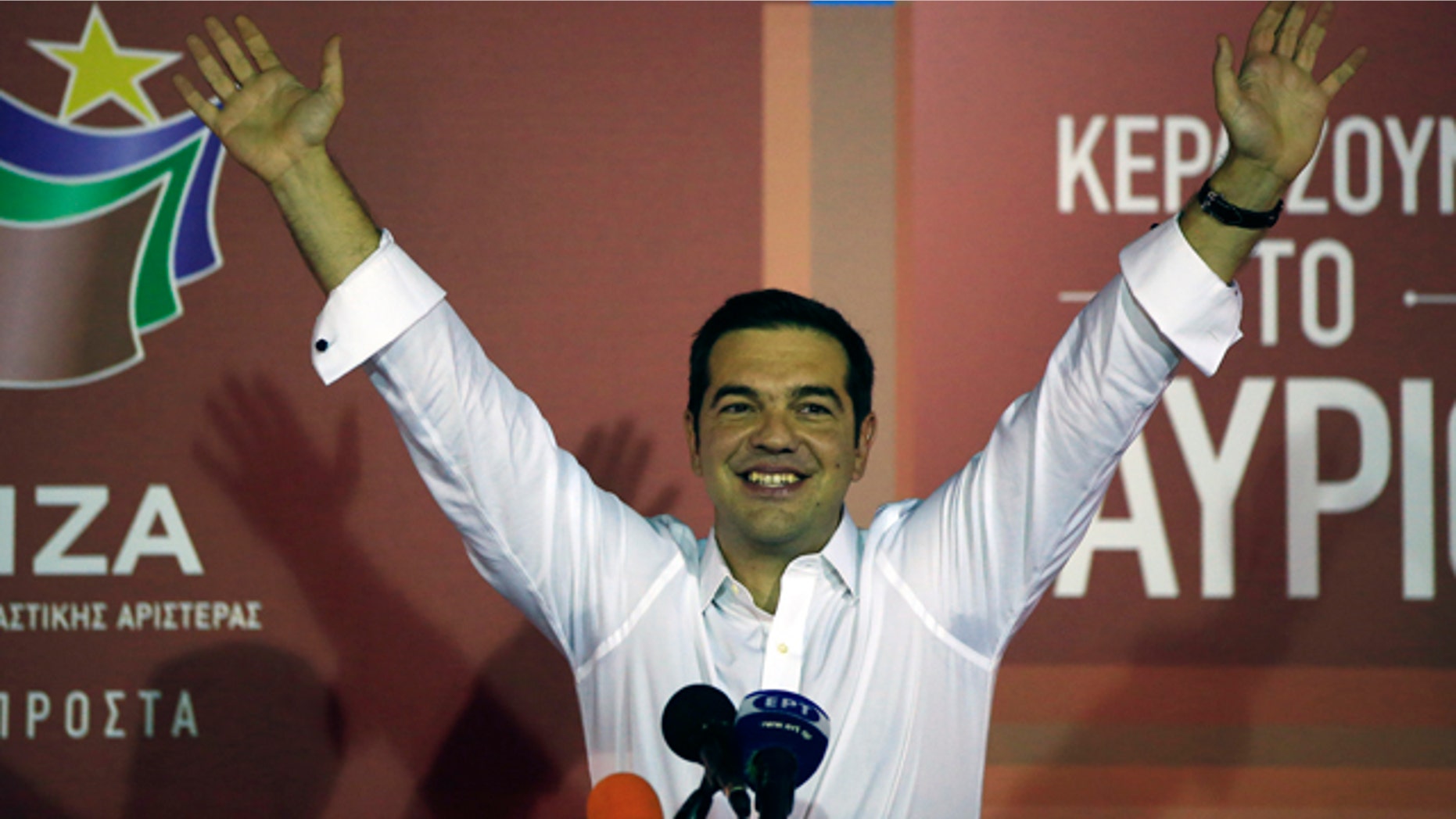 Sept. 20, 2015: Alexis Tsipras the leader of left-wing Syriza party waves to his supporters after the election results at the party's main electoral center in Athens. (AP Photo/Lefteris Pitarakis)