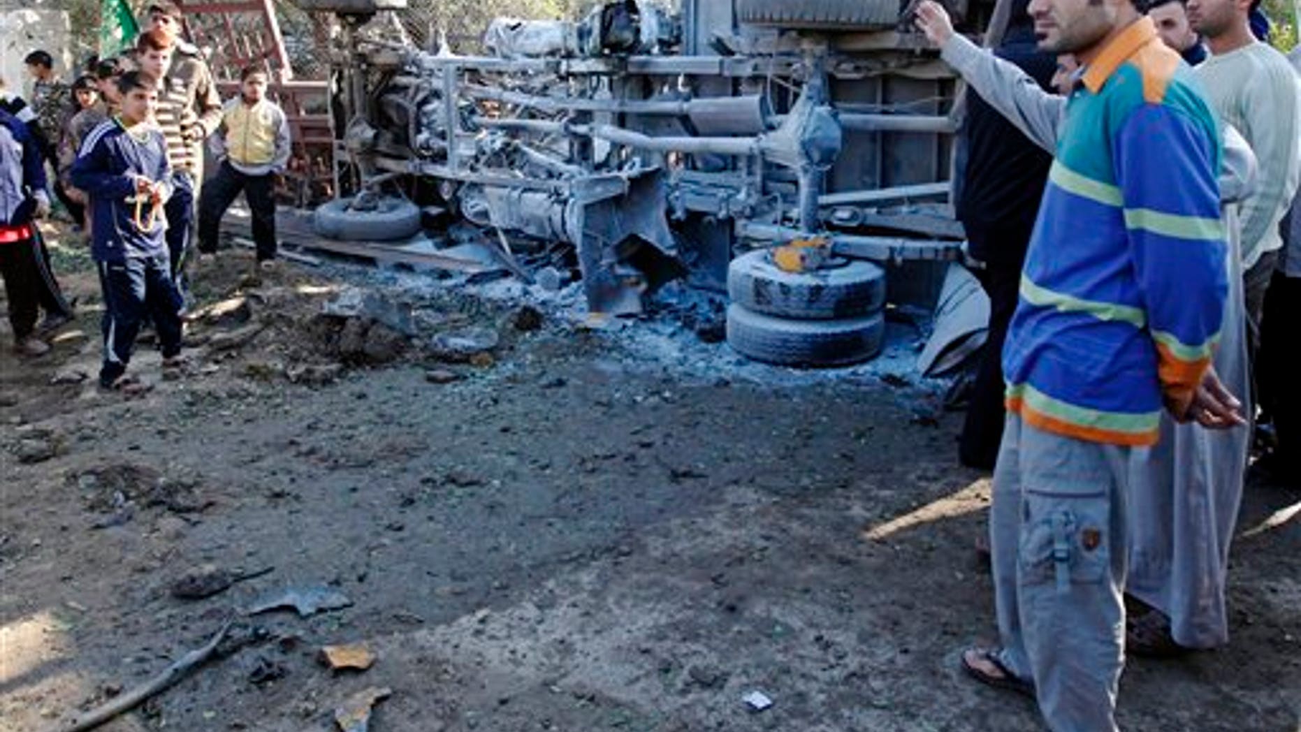 Jan. 24, 2011: Iraqis gather at the site of a car bomb attack in Baghdad, Iraq.