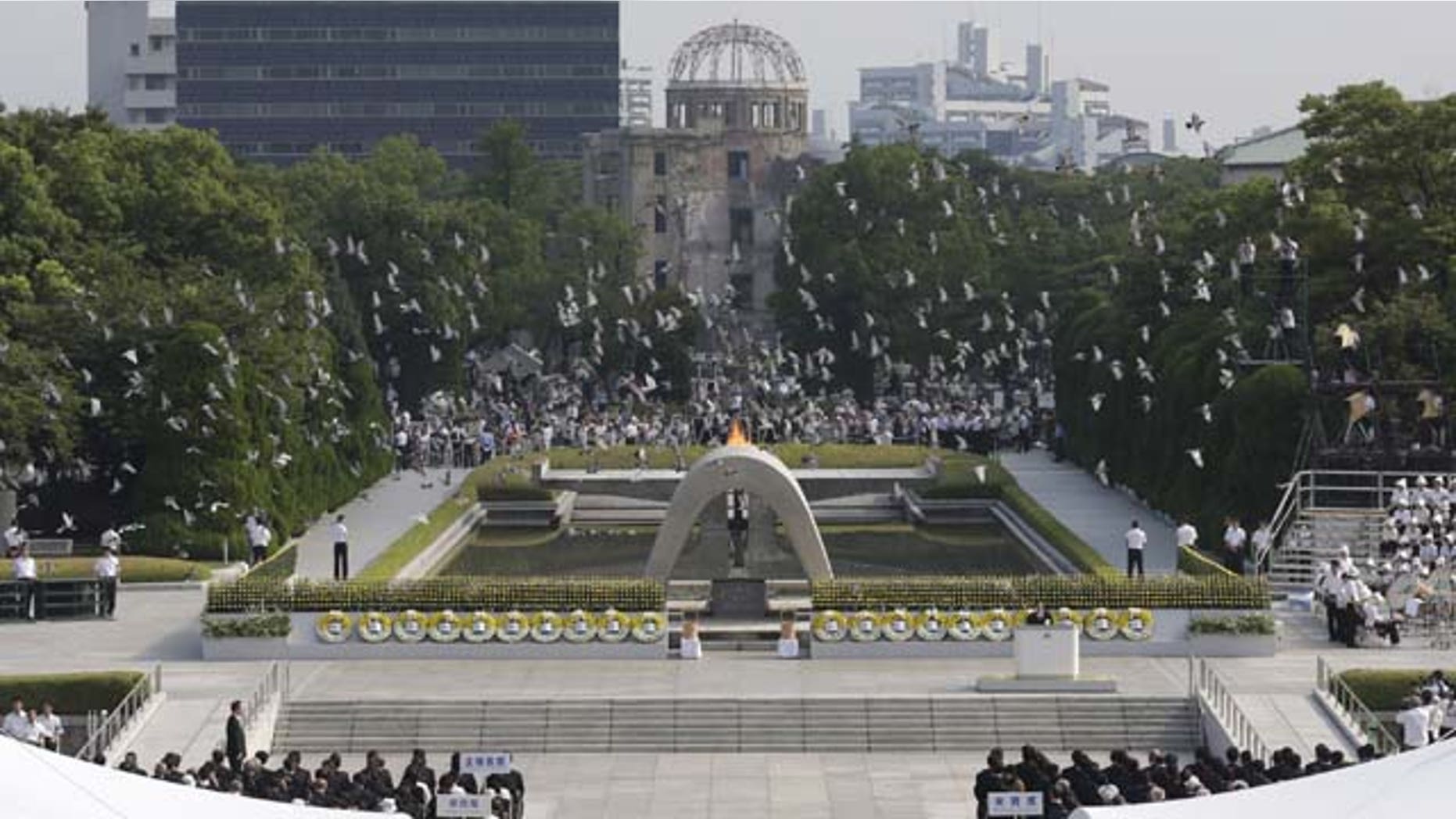 August 6, 2013: Doves fly over the cenotaph dedicated to the victims of the atomic bombing at the Hiroshima Peace Memorial Park during the ceremony to mark the 68th anniversary of the bombing, in Hiroshima, western Japan. (AP Photo)