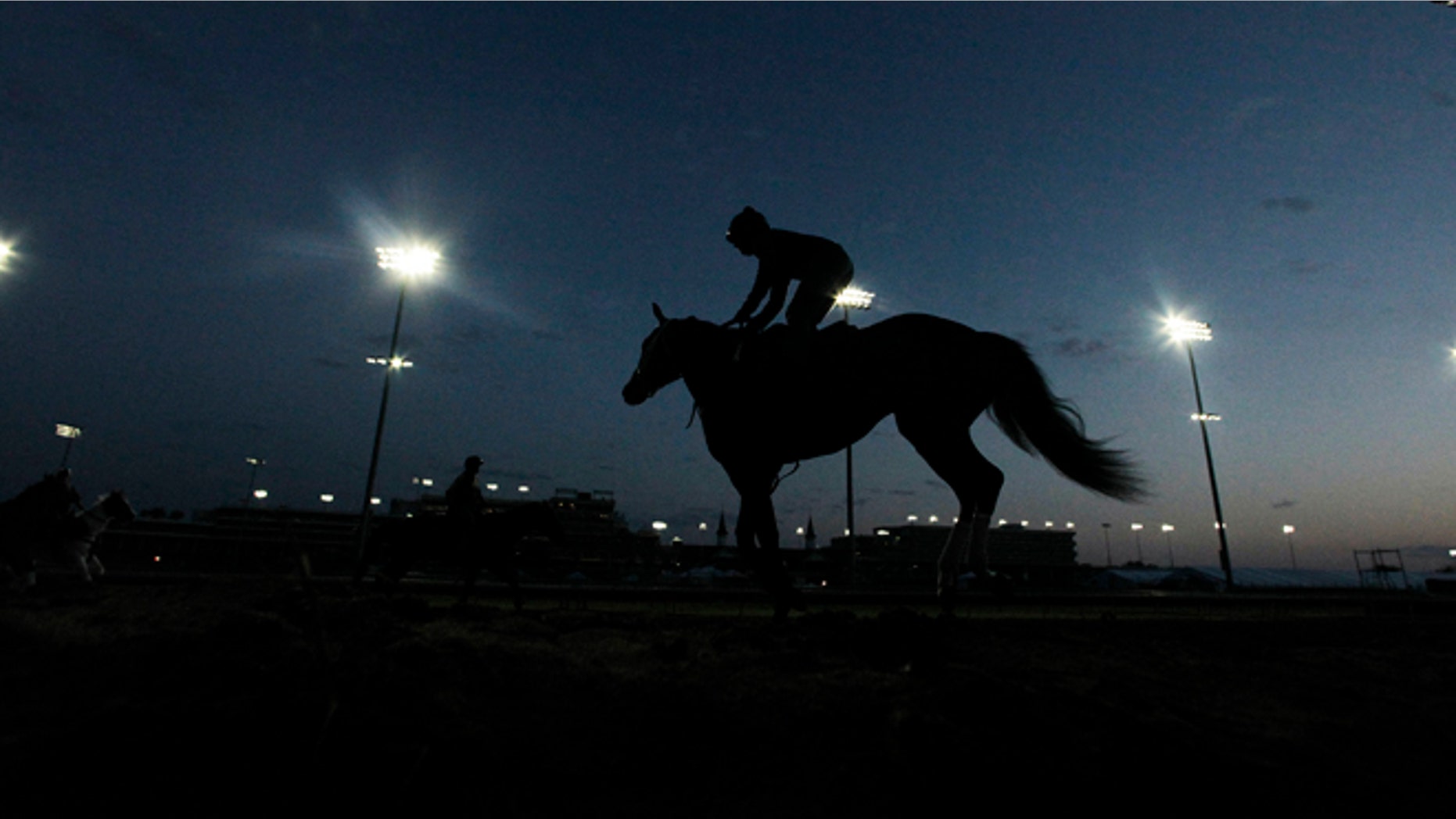 May 2, 2012: Horses workout before the sun come up at Churchill Downs in Louisville, Kentucky.
