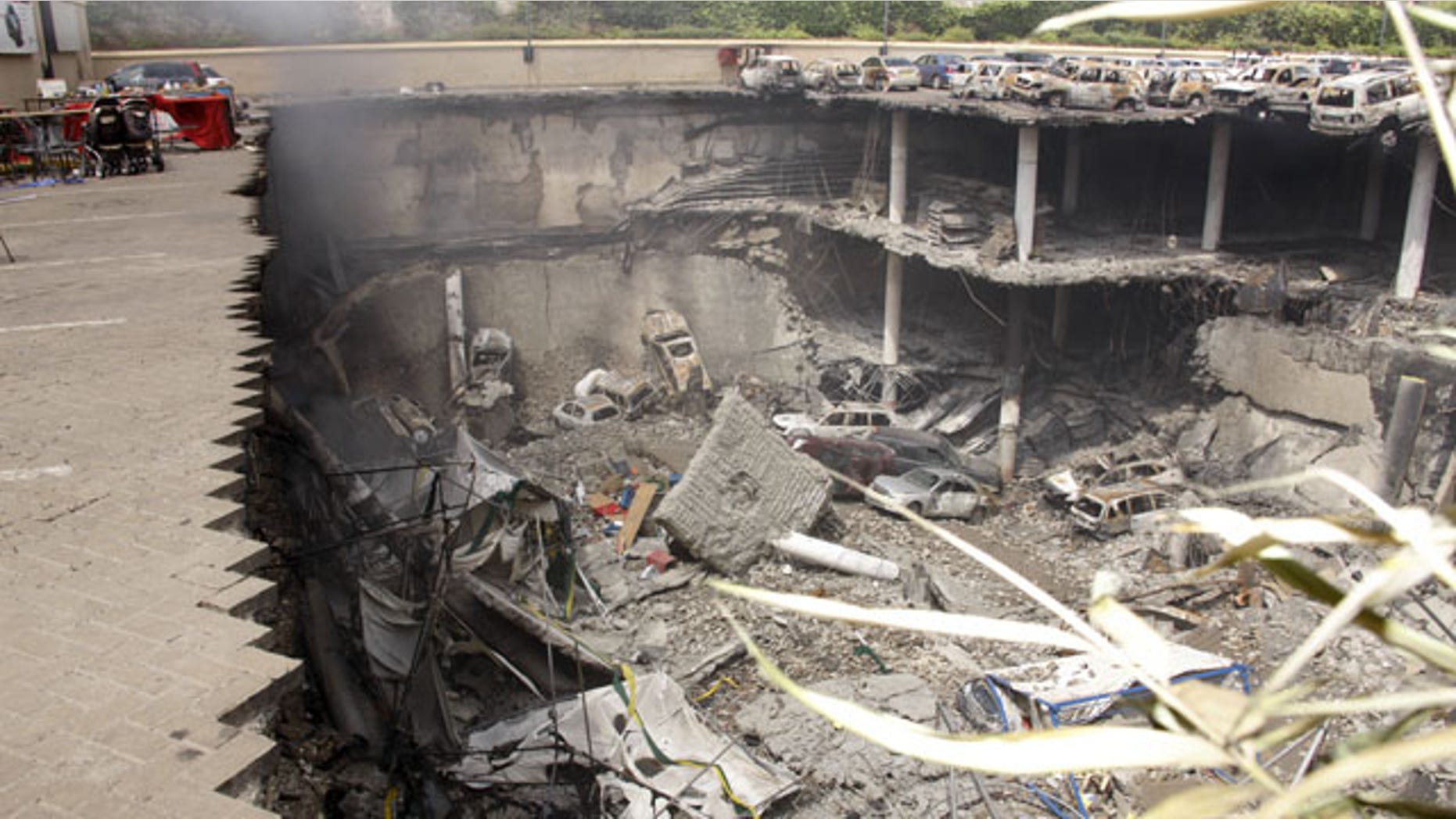 September 26, 2013: This photo released by the Kenya Presidency shows the collapsed upper car park of the Westgate Mall in Nairobi, Kenya.