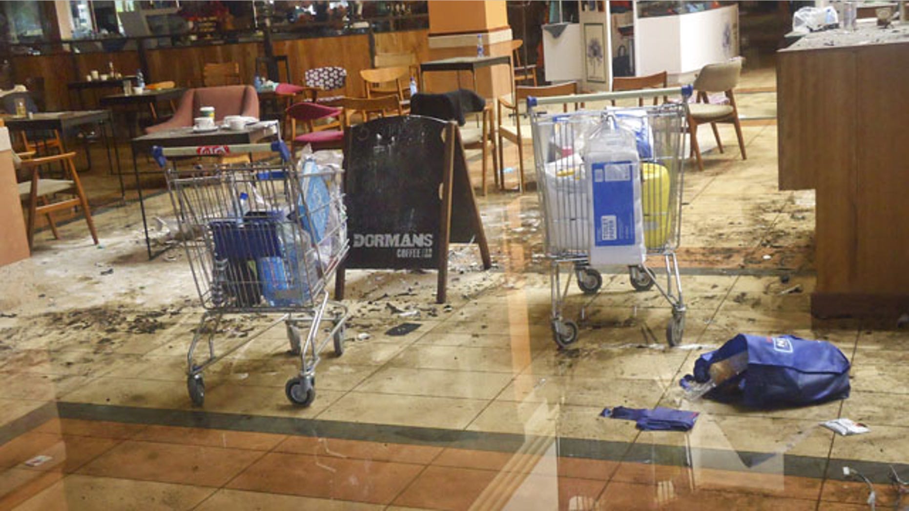 September 30, 2013: This photo taken Friday, Sept. 27, 2013 shows the scene at the Dormans coffee shop on the ground floor of the Westgate Mall in Nairobi, Kenya. (AP Photo)
