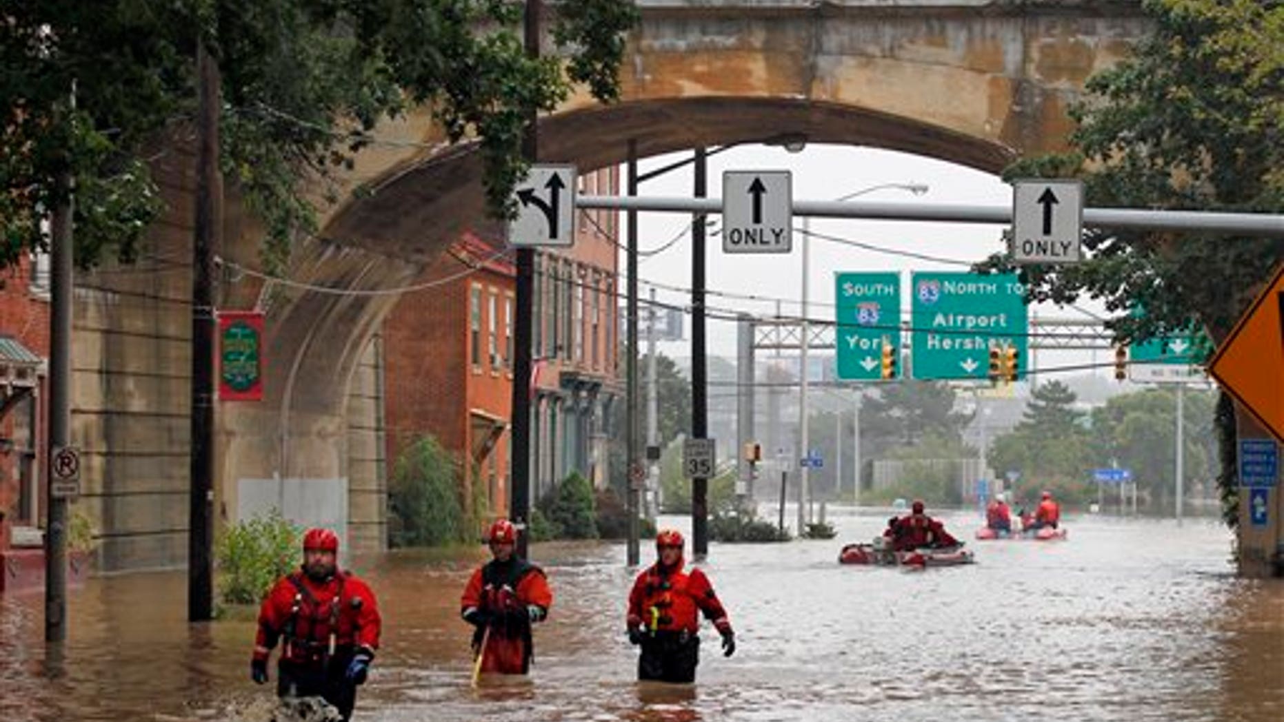 Sept. 9: Members of the Harrisburg River Rescue unit walk out of the water after launching a boat to take Mayor Linda Thompson to the flooded Shipoke area during flooding caused by rainfall from the remnants of Tropical Storm Lee, in Harrisburg, Pa.