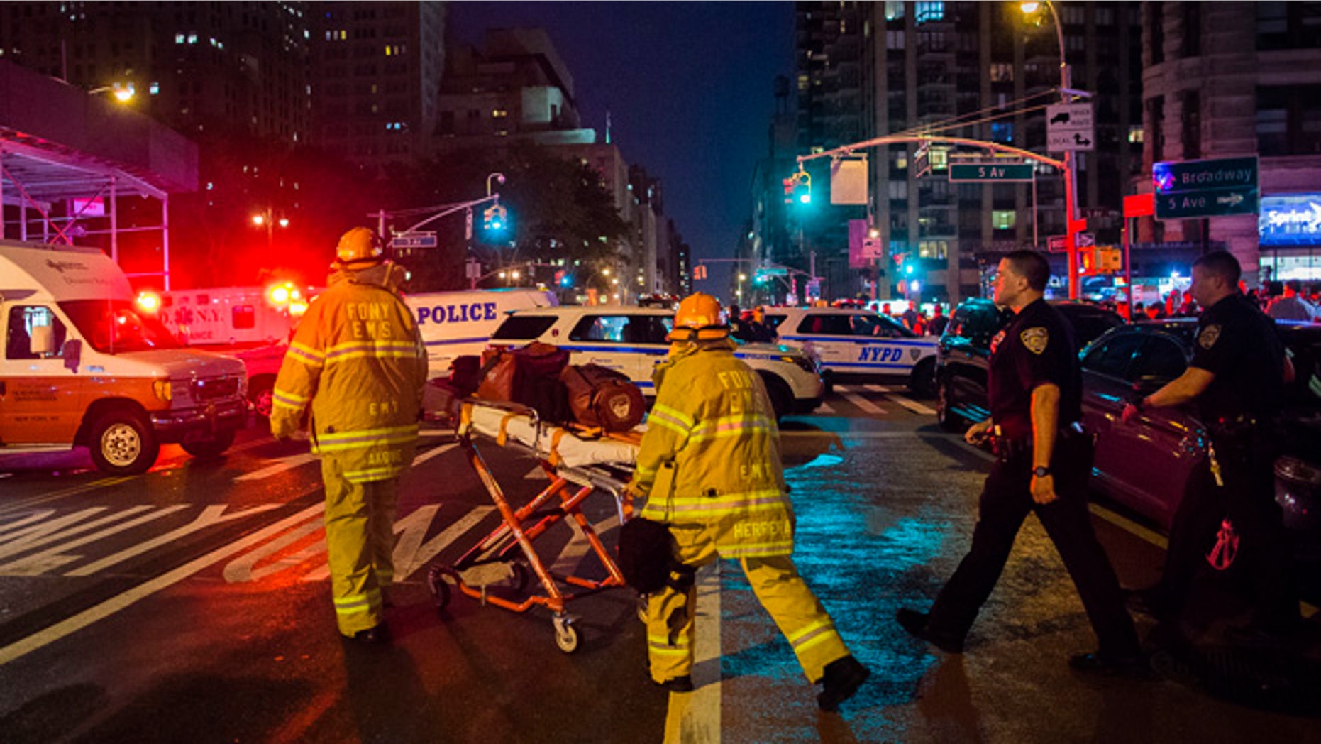 Police and firefighters work near the scene of an apparent explosion in Manhattan's Chelsea neighborhood, in New York, Saturday, Sept. 17, 2016. A law enforcement official tells The Associated Press that an explosion in the Chelsea neighborhood appears to have come from a construction toolbox in front of a building. The official spoke on condition of anonymity because the person wasn't authorized to speak about an ongoing investigation. More than two dozen people have sustained minor injuries in the explosion on West 23rd Street.(AP Photo/Andres Kudacki)