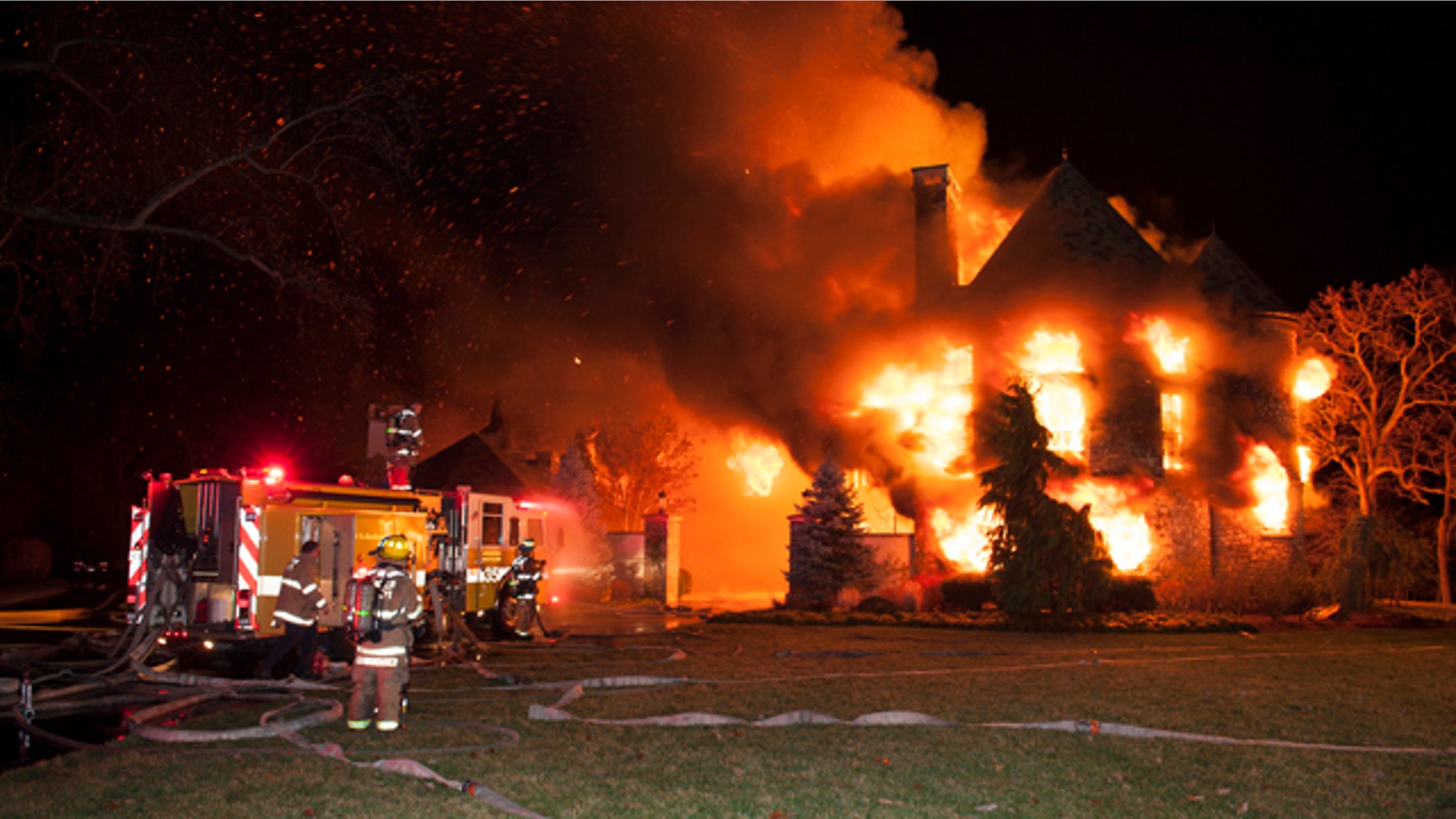 Jan. 19, 2015: Firefighters battle a four-alarm fire at a home on Childs Point Road, in Annapolis, Md. (AP Photo/Capital Gazette, Glenn A. Miller)