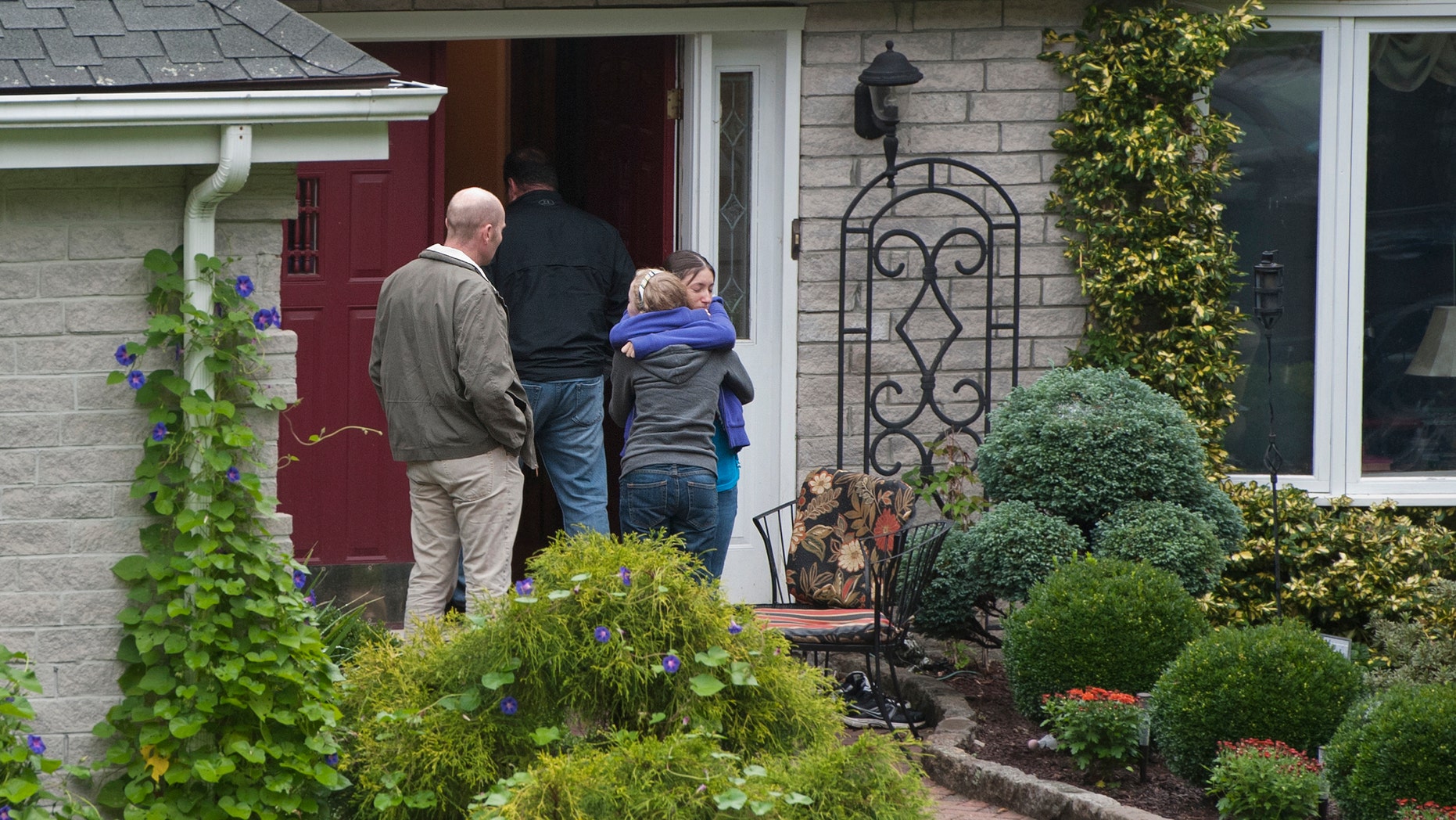 Sept. 28, 2012: Visitors arrive at the home of Jeffrey Giuliano in New Fairfield, Conn. Giuliano fatally shot a masked teenager in self-defense during what appeared to be an attempted burglary early Thursday morning, then discovered that he had killed his son, Tyler, state police said.