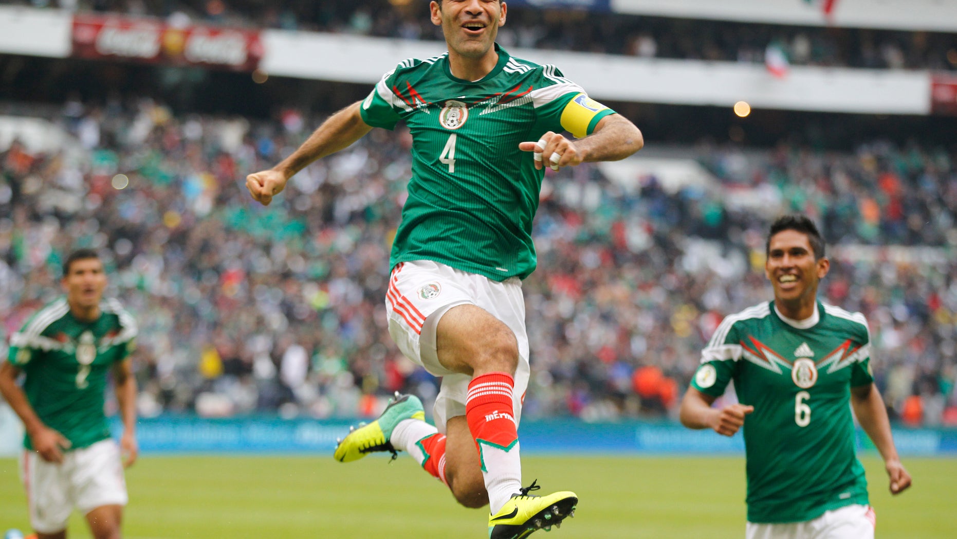 Mexico's Rafael Marquez celebrates after scoring his team's 5th goal during a 2014 World Cup playoff first round match against New Zealand in Mexico City, Wednesday, Nov. 13, 2013. (AP Photo/Eduardo Verdugo)