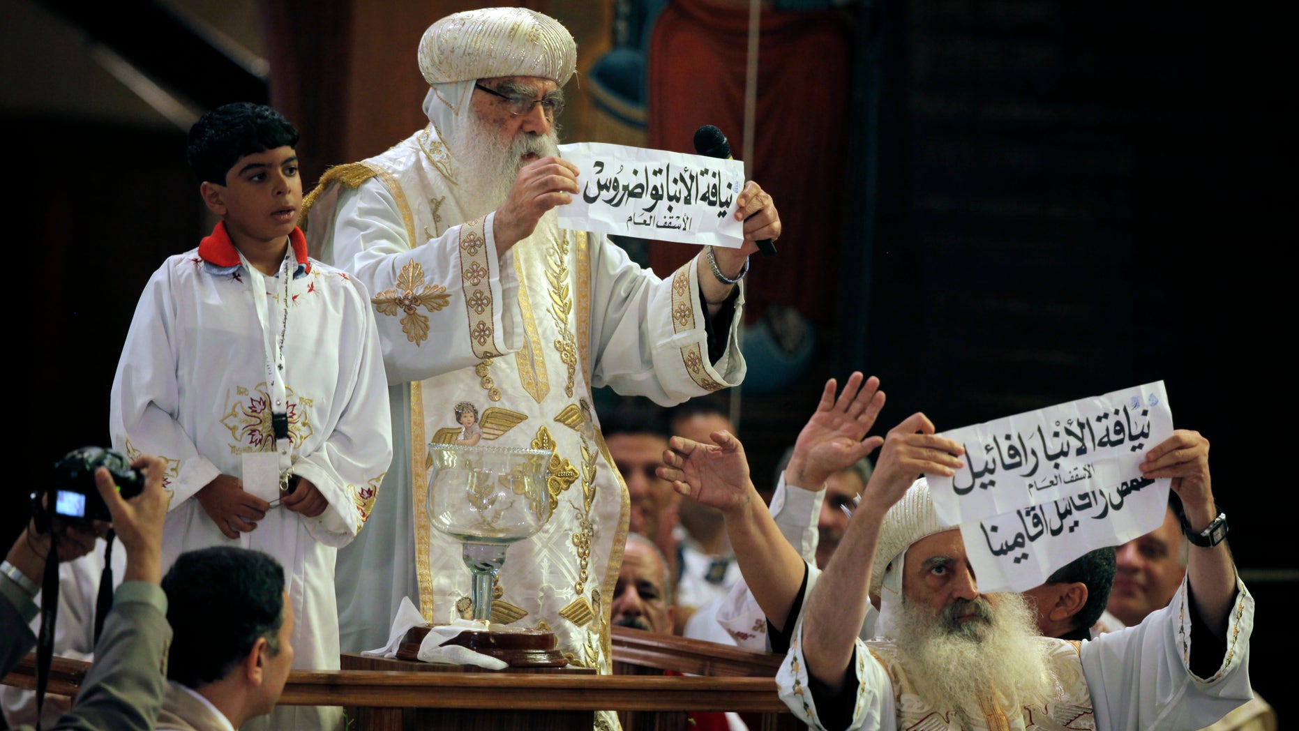 Coptic Christians in Egypt, led by acting Coptic Pope Pachomios, center, say the nation doesn't do enough to protect them from discrimination inside and outside of the nation's borders. (AP)