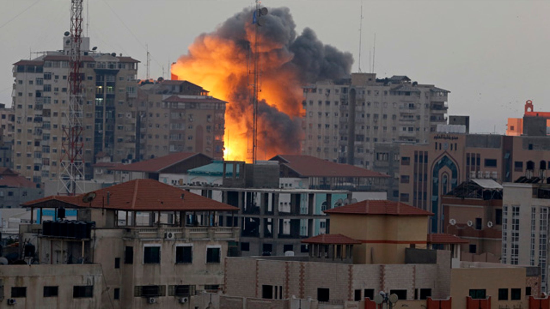 A ball of fire rises from an explosion on al-Zafer apartment tower following an Israeli air strike in Gaza City, in the northern Gaza Strip during last summer's clash. (AP)