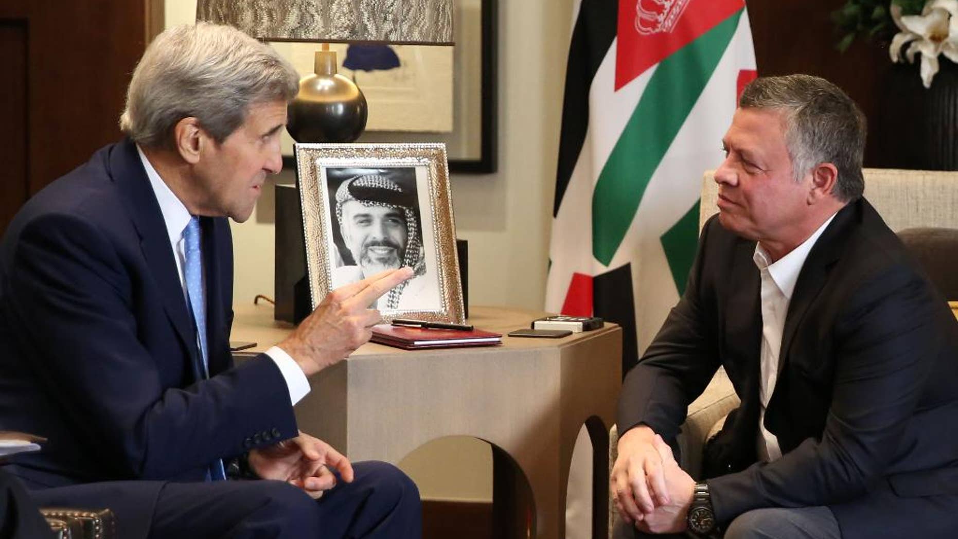Jordanian King Abdullah II, right, meets with U.S. Secretary of State John Kerry at the Royal Palace in Amman Jordan, Saturday, Oct. 24 2015. Kerry said Saturday that Israel and Jordan have agreed on steps aimed at reducing tensions at a holy site in Jerusalem that have fanned Israeli-Palestinian violence. (AP Photo/Raad Adayleh)