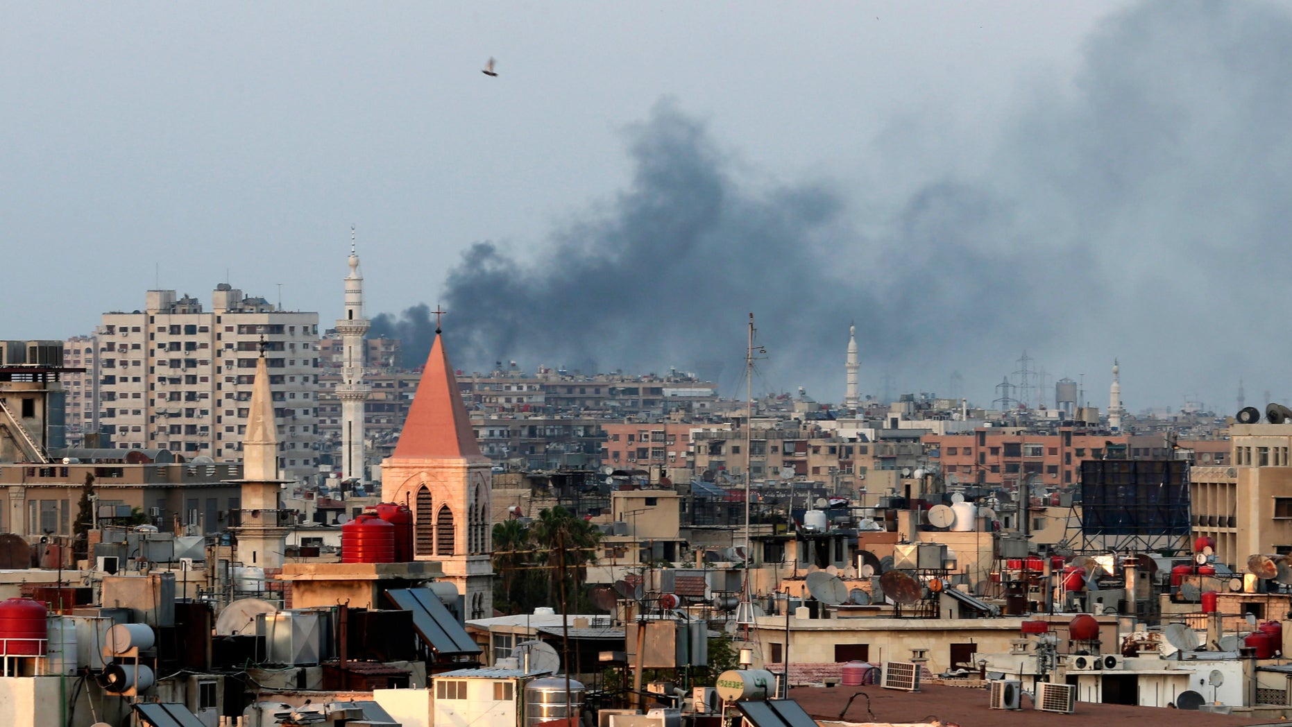 Aug. 22, 2013: Columns of smoke rising from heavy shelling in the Jobar neighborhood in west Damascus, in Cairo, Syria.
