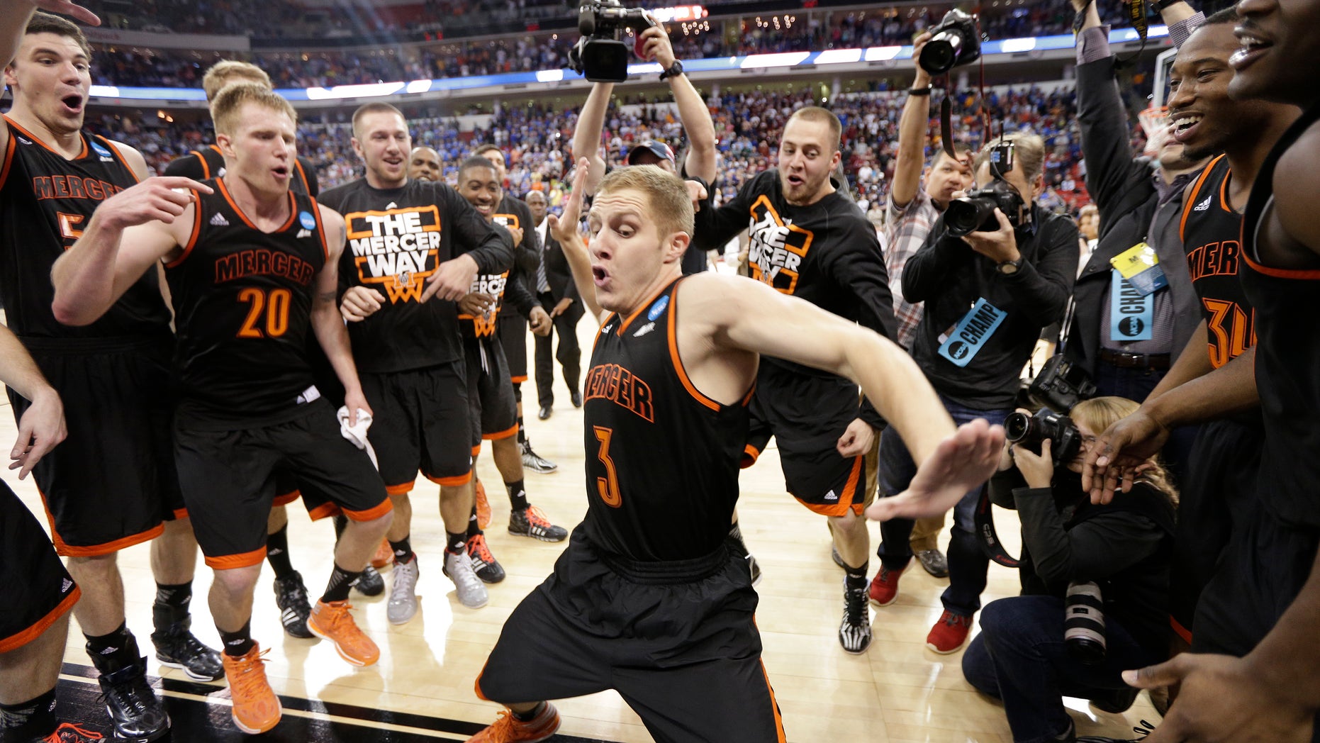 March 21, 2014: Mercer guard Kevin Canevari (3) dances with team mates after the second half of an NCAA college basketball second-round game against Duke, in Raleigh, N.C.