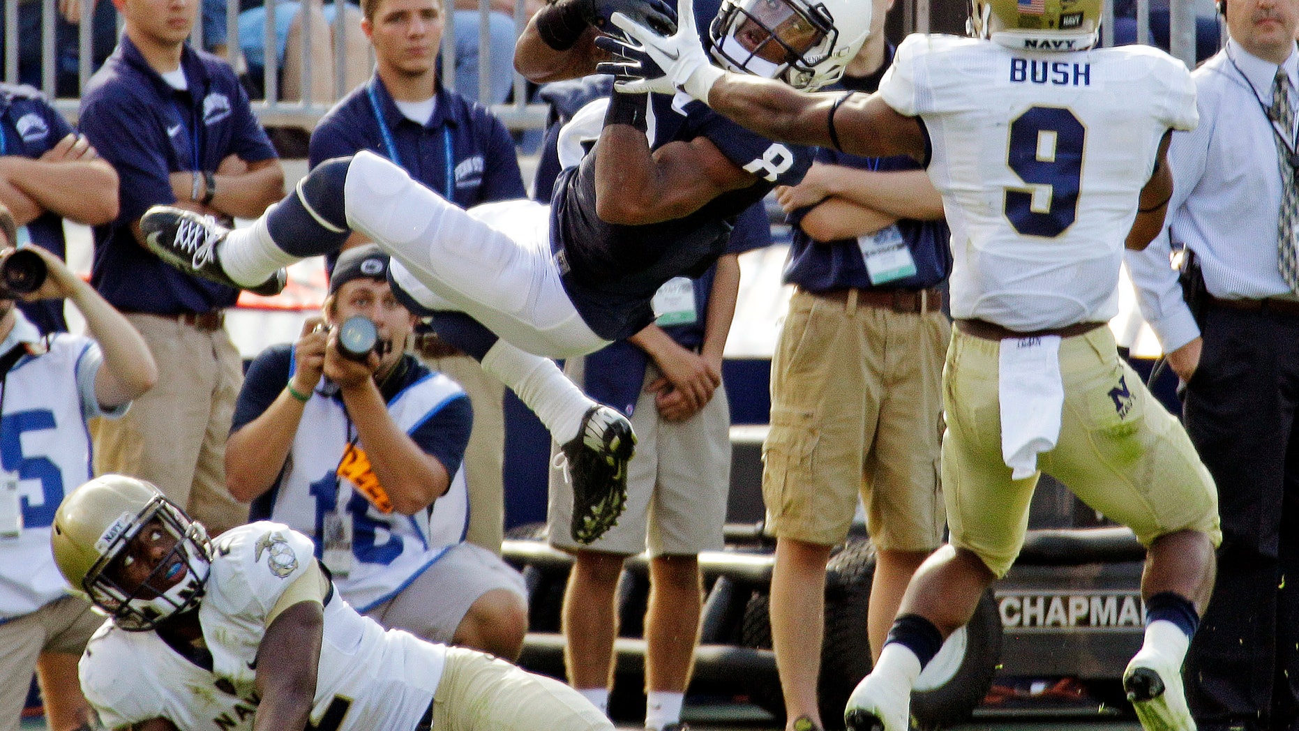 Sept. 15, 2012: Penn State wide receiver Allen Robinson (8) cannot hang on to a pass after colliding with Navy cornerback Parrish Gaines (2) and safety Tra'ves Bush (9) during the second quarter of an NCAA college football game in State College, Pa.