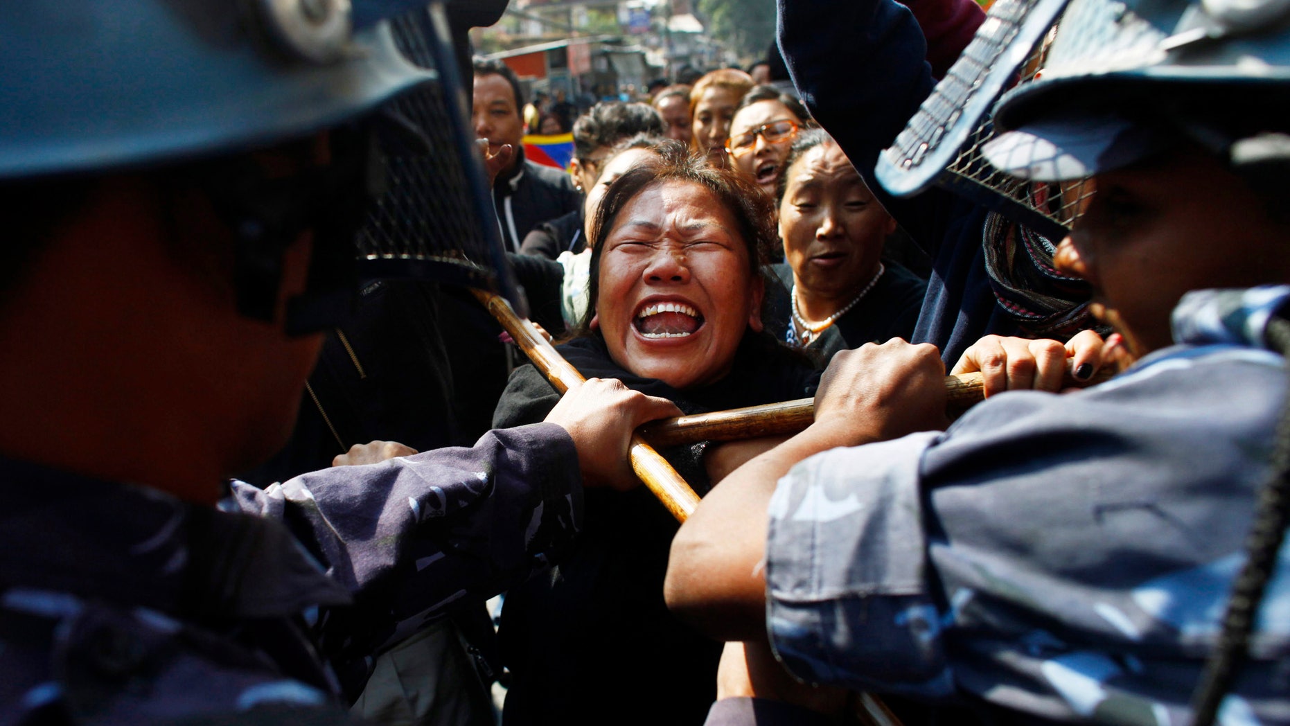 Nov. 1, 2011: Nepal police detain a Tibetan who was shouting anti-China slogans in tribute to the Tibetans who died in the recent self-immolation, in Katmandu, Nepal.