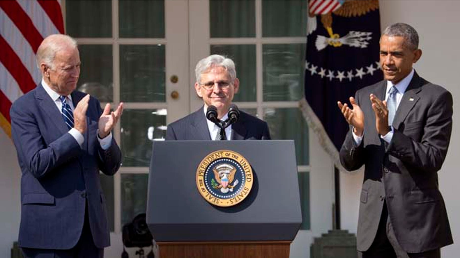 Federal appeals court judge Merrick Garland, receives applauds from President Barack Obama and Vice President Joe Biden as he is introduced as Obama's nominee for the Supreme Court during an announcement in the Rose Garden of the White House, in Washington, Wednesday, March 16, 2016. Garland, 63, is the chief judge for the United States Court of Appeals for the District of Columbia Circuit, a court whose influence over federal policy and national security matters has made it a proving ground for potential Supreme Court justices. (AP Photo/Pablo Martinez Monsivais)