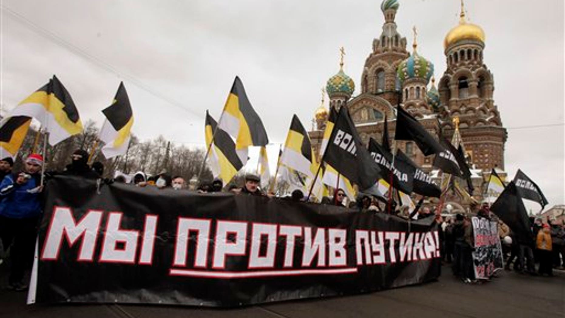 Feb. 25: Protesters attend a massive protest rally against Prime Minister Vladimir Putin's rule in St. Petersburg, Russia, Saturday. The poster reads: 'We against Putin.'