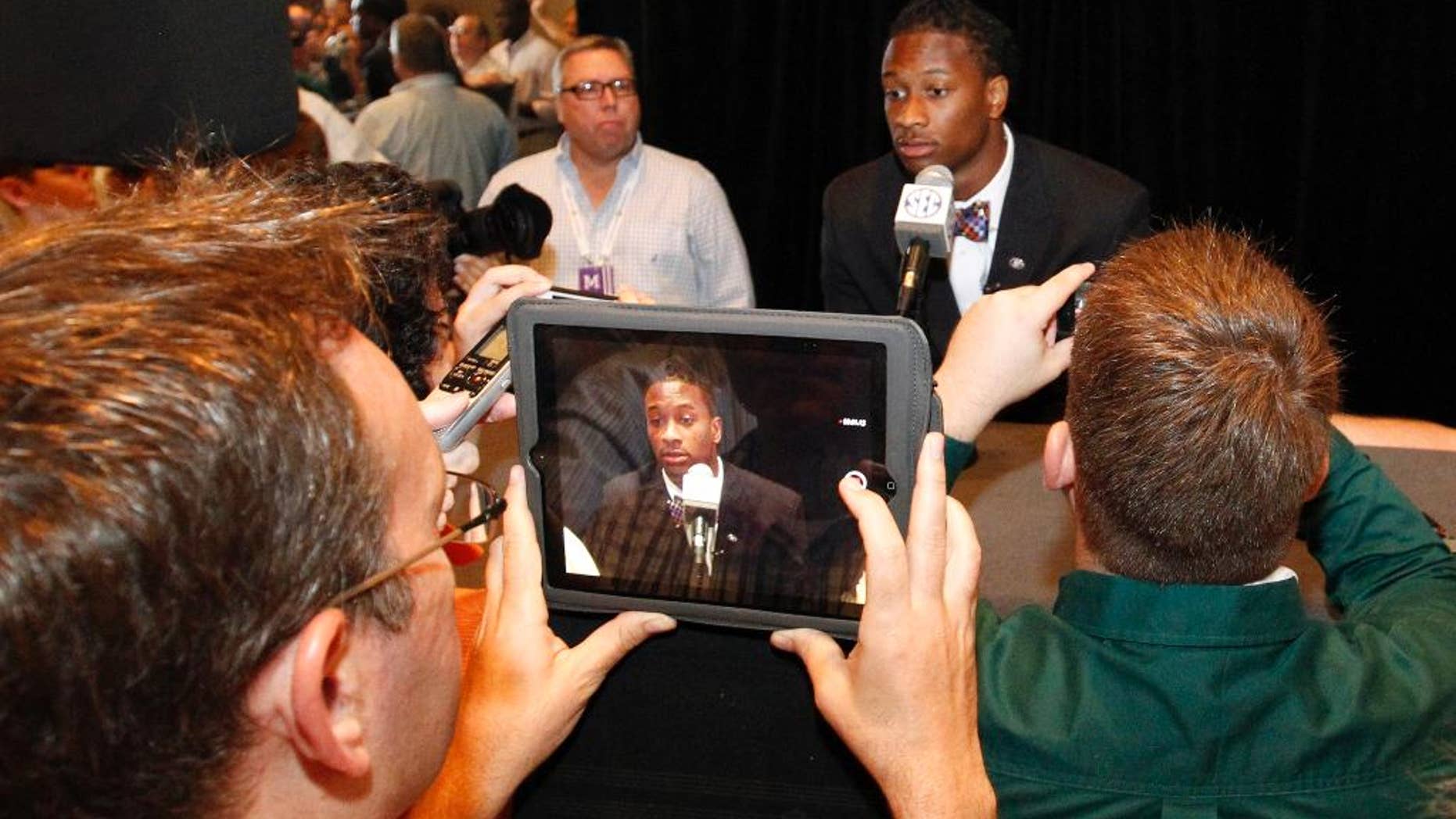 Georgia tailback Todd Gurley speaks to the media at the Southeastern Conference NCAA college football media days, Thursday, July 17, 2014, in Hoover, Ala. (AP Photo/Butch Dill)
