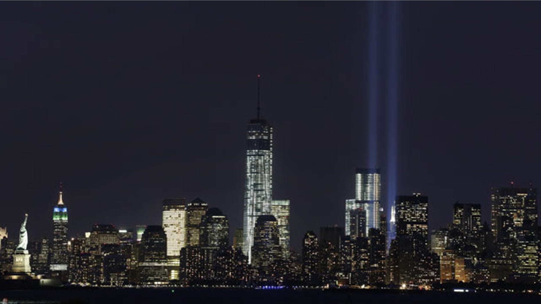 September 9, 2013: The Tribute in Light rises above the lower Manhattan skyline and One World Trade Center, center, in a test of the memorial light display in New York. The twin beams of light will also appear Wednesday, Sept. 11, twelve years after the terrorist attacks of Sept. 11, 2001. (AP Photo)