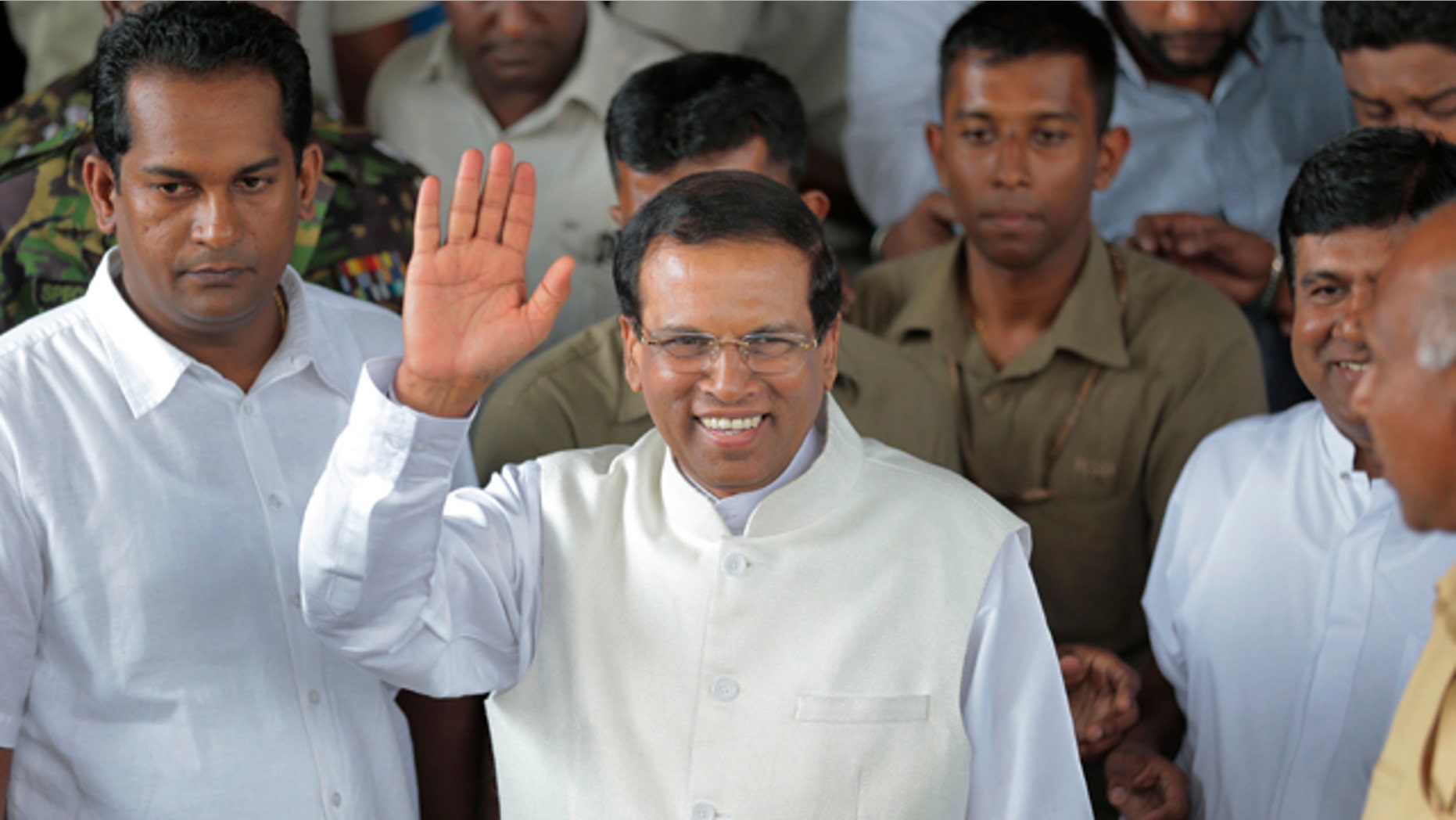 Jan. 9, 2015: Sri Lanka incoming President Maithripala Sirisena waves to supporters as he leaves the election secretariat in Colombo. (AP Photo/Eranga Jayawardena)