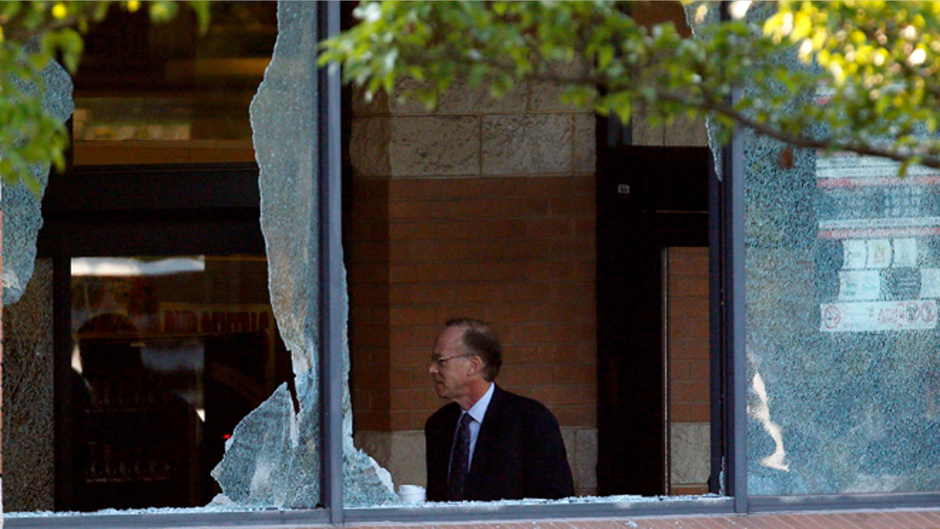 Aug. 31, 2012: Middlesex County prosecutor Bruce Kaplan inspects the scene of a shooting at a Pathmark grocery store in Old Bridge, N.J.