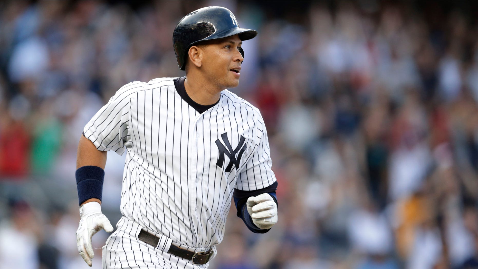 New York Yankees' Alex Rodriguez watches his home run, his 3,000th career hit, during the first inning of a baseball game against the Detroit Tigers on Friday, June 19, 2015, in New York. (AP Photo/Frank Franklin II)