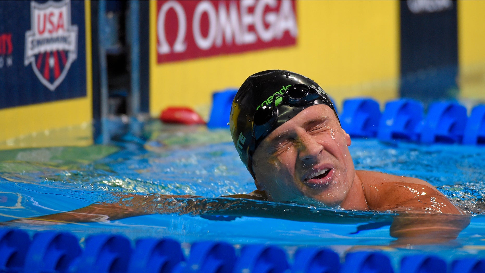 Ryan Lochte reacts after swimming in the men's 200-meter freestyle final at the U.S. Olympic swimming trials, Tuesday, June 28, 2016, in Omaha, Neb. (AP Photo/Mark J. Terrill)