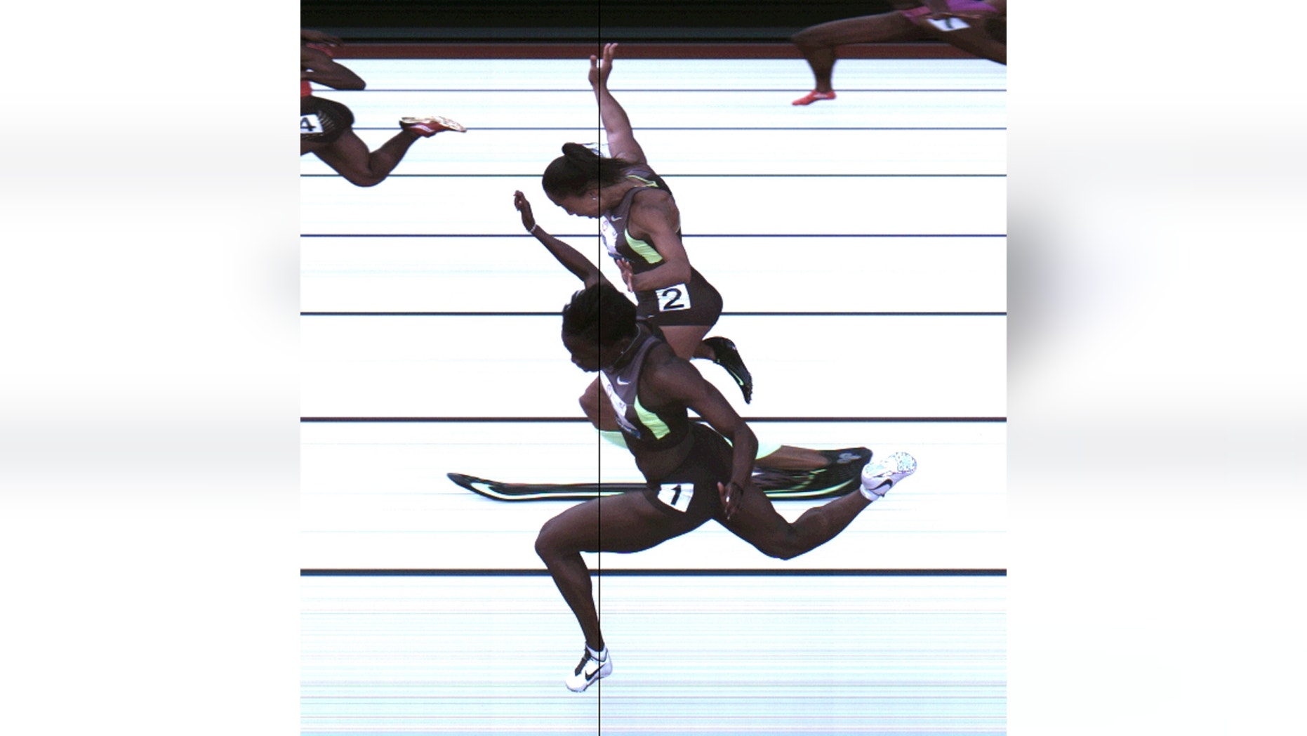 June 23, 2012: Allyson Felix and Jeneba Tarmoh, in foreground, finished in a dead heat for the last U.S. spot in the 100 to the London Games, each leaning across the finish line in 11.068 seconds, during the U.S. Olympic Track and Field Trials in Eugene, Ore.