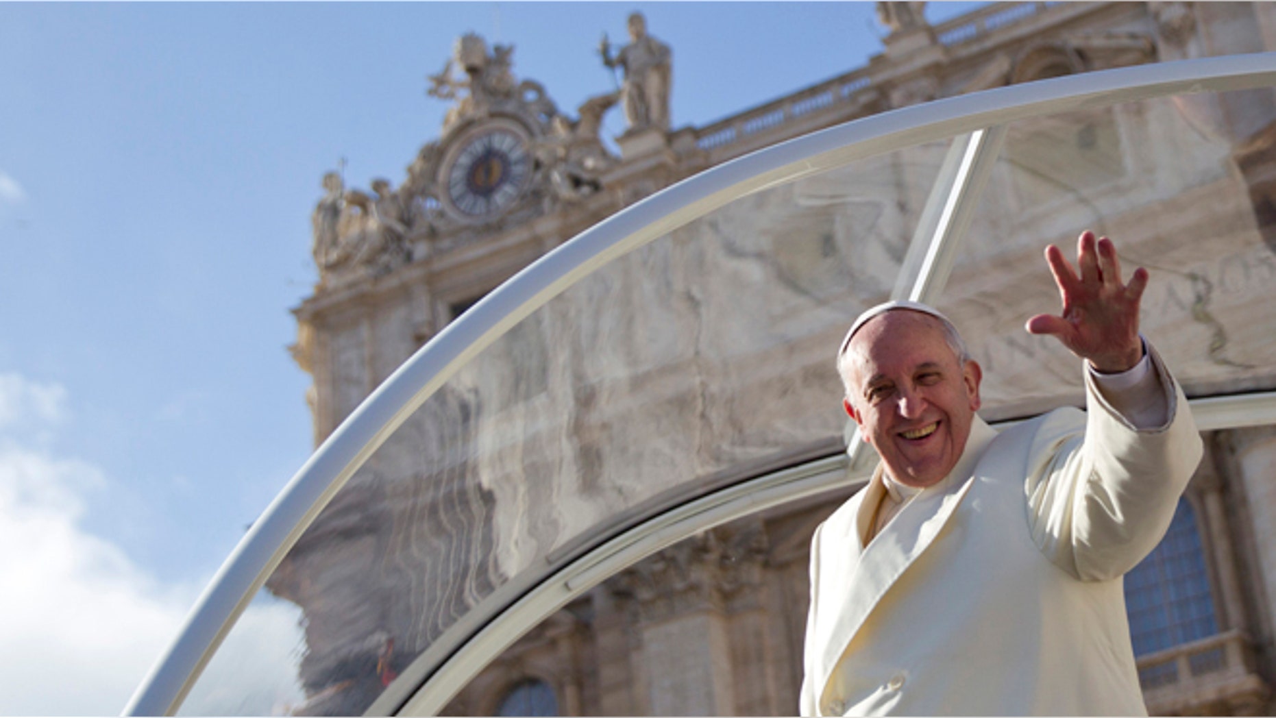 FILE -- Jan. 15, 2014: Pope Francis waves from his pope-mobile at the end of his weekly general audience, in St. Peter's Square, at the Vatican.