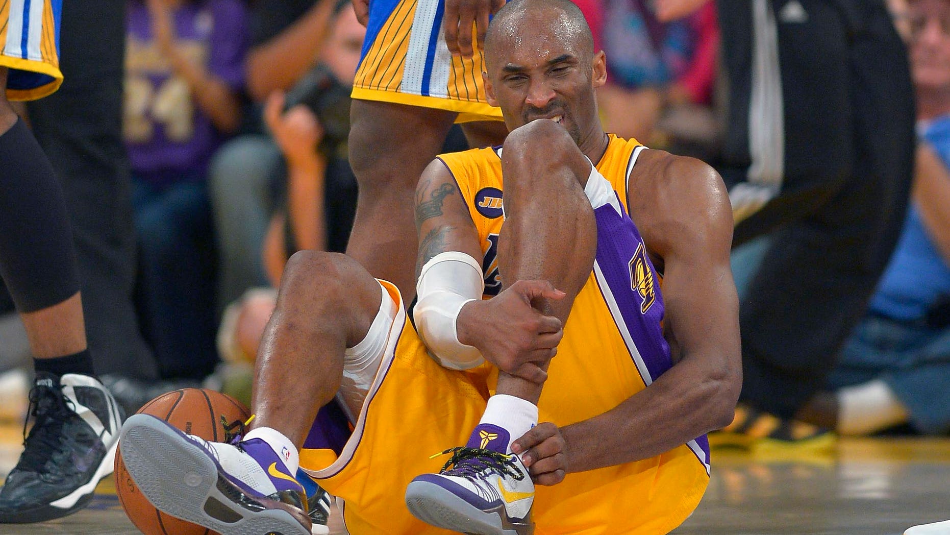 April 12, 2013: Los Angeles Lakers guard Kobe Bryant grimaces after being injured during the second half of their NBA basketball game against the Golden State Warriors in Los Angeles.
