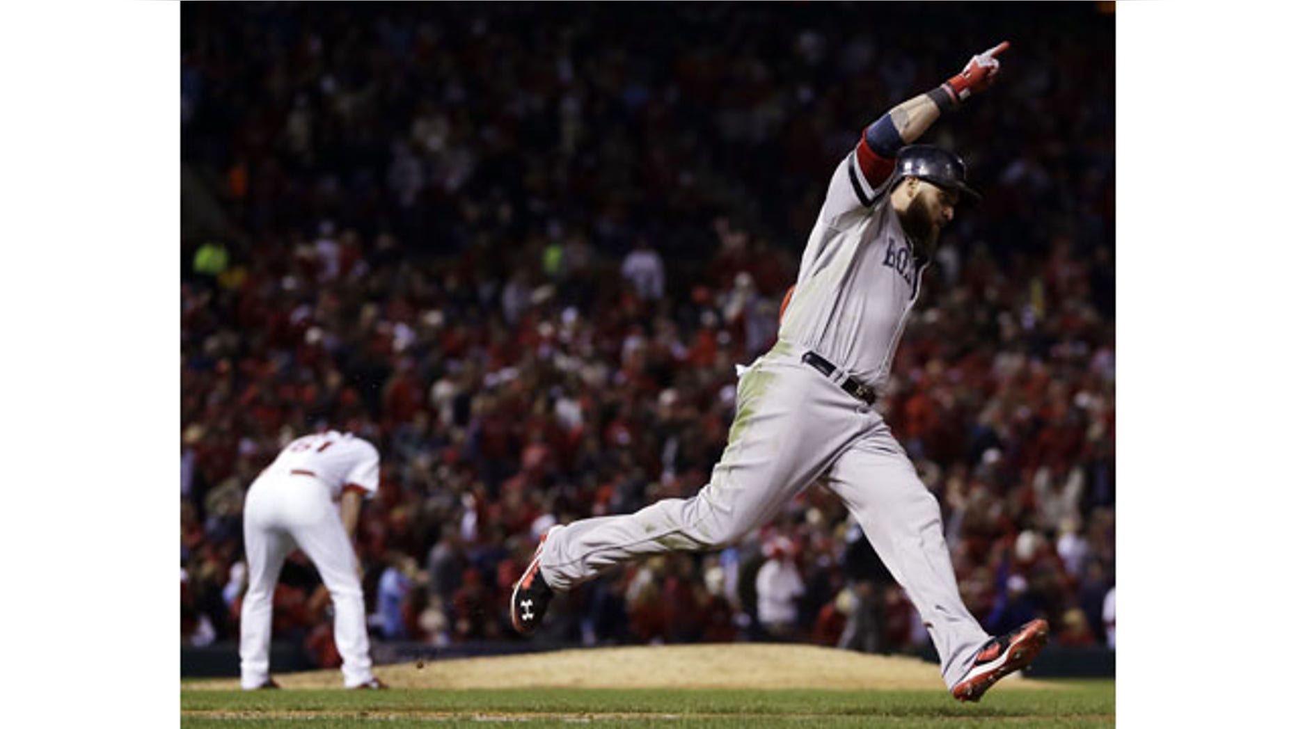 Boston Red Sox's Jonny Gomes celebrates his three-run home run off St. Louis Cardinals relief pitcher Seth Maness, left, during the sixth inning of Game 4 of baseball's World Series Sunday, Oct. 27, 2013, in St. Louis. (AP Photo/Jeff Roberson)
