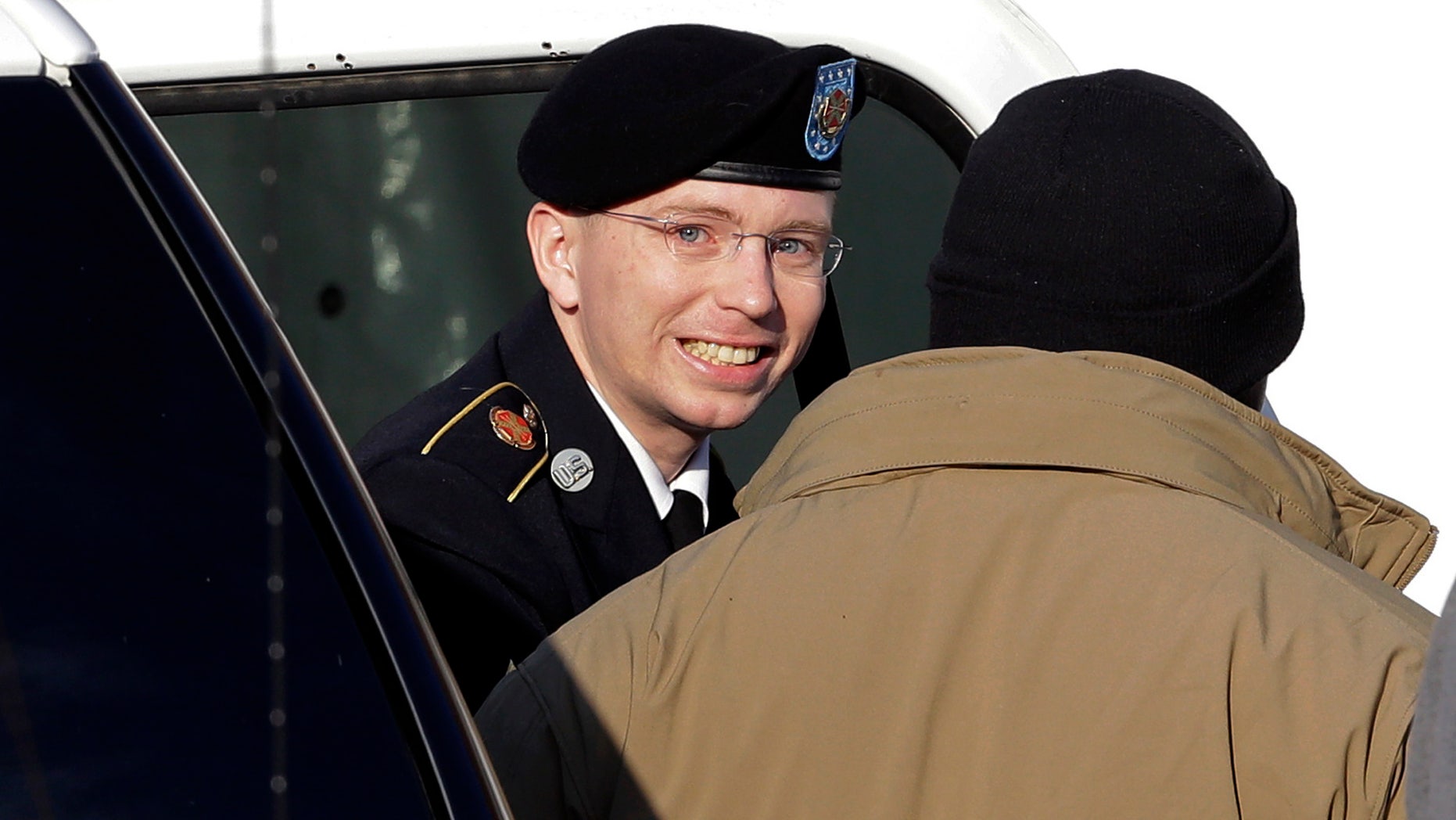 Nov. 28, 2012: Army Pfc. Bradley Manning, center, steps out of a security vehicle as he is escorted into a courthouse in Fort Meade, Md., for a pretrial hearing.
