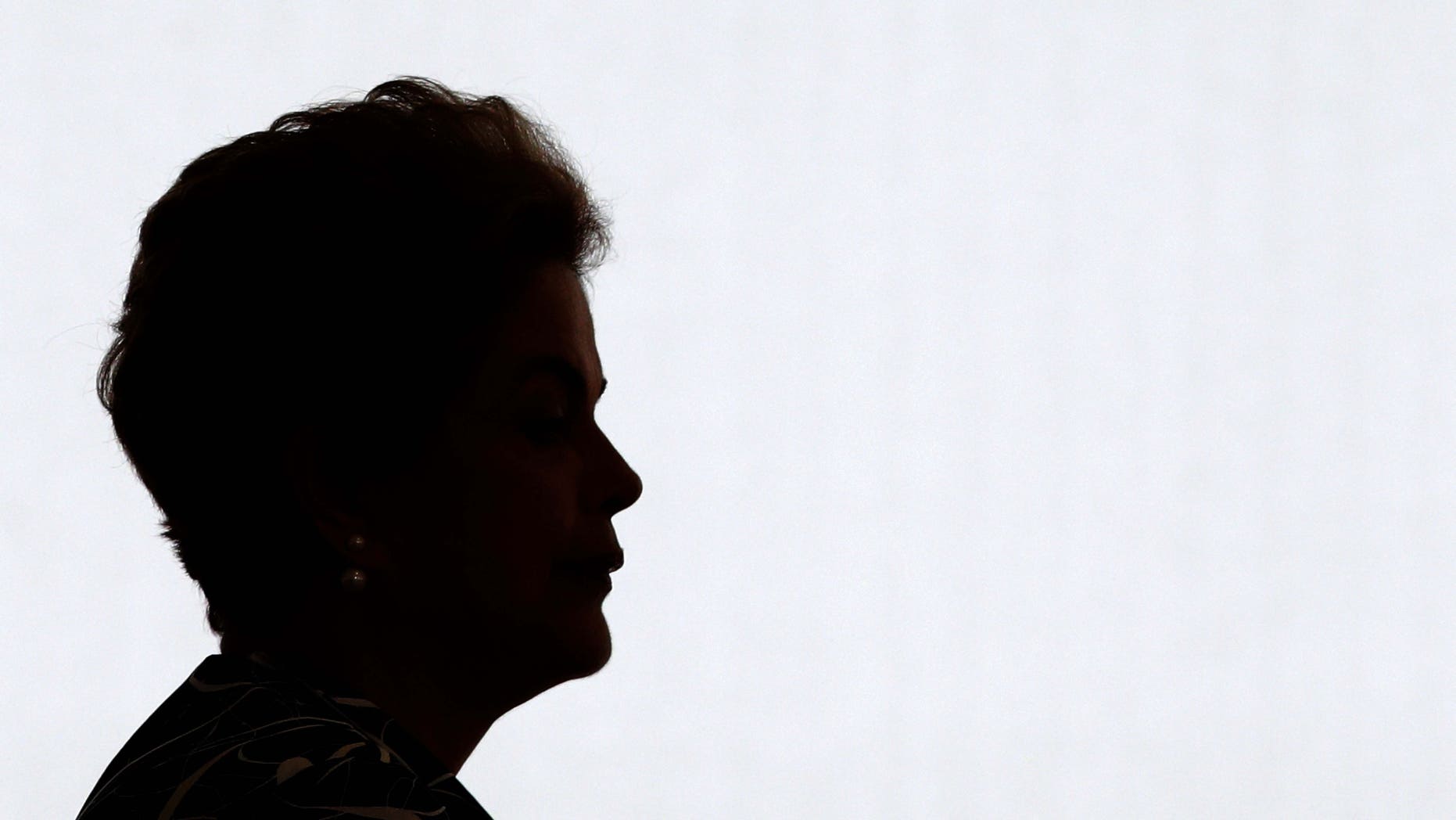 Brazil's President Dilma Rousseff arrives for a ceremony to announce an addition to the government subsidized housing program coined "My home, My life, at Planalto presidential palace in Brasilia, Brazil, Friday, May 6, 2016. Brazil's Senate impeachment commission has started deliberations over whether to recommend Rousseff's suspension to the full house. A Friday vote by a simple majority will send the case to all senators for a final decision Wednesday. (AP Photo/Eraldo Peres)