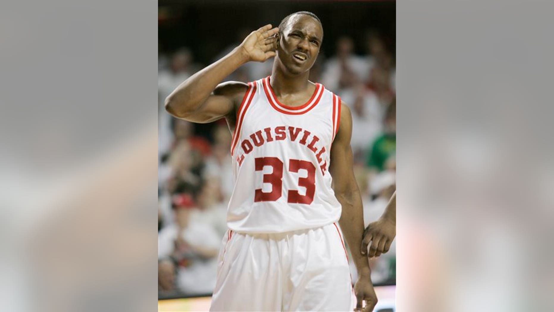 2009 file photo of Andre McGee, who played for Louisville before becoming a staffer. (AP Photo/Ed Reinke)