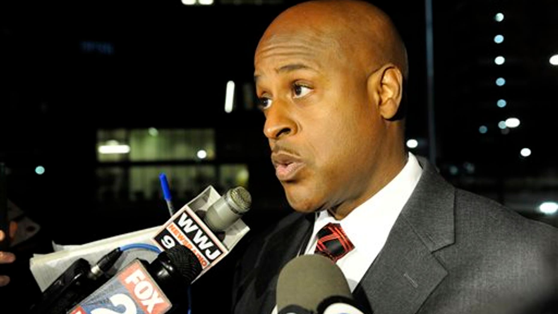 Eric Jones, Detroit interim executive fire commissioner, tells reporters two emergency medical technicians responded to a 911 call and were treating the woman for an injured ankle when the man attacked one of the EMTs. Jones says the other EMT tried to intervene and was attacked. (David Coates/The Detroit News via AP)