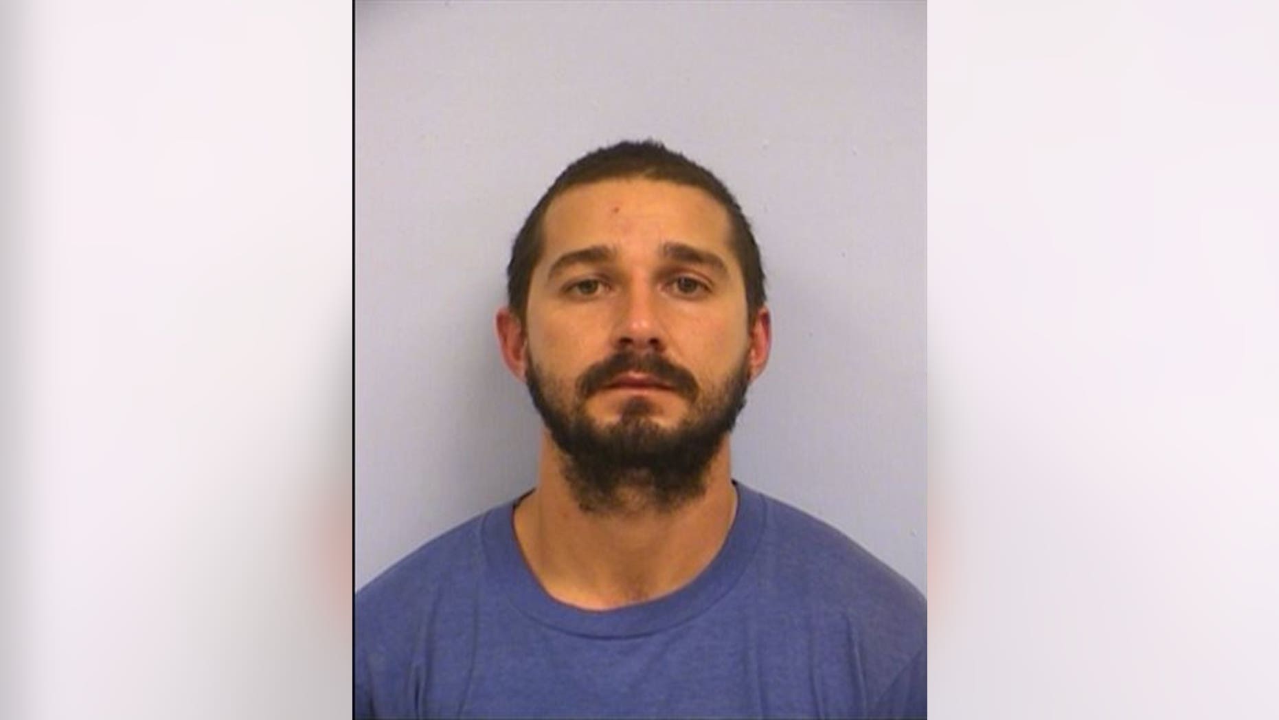 This booking mug provided by the Austin Police Department shows actor Shia LaBeouf. (Austin Police Department via AP)