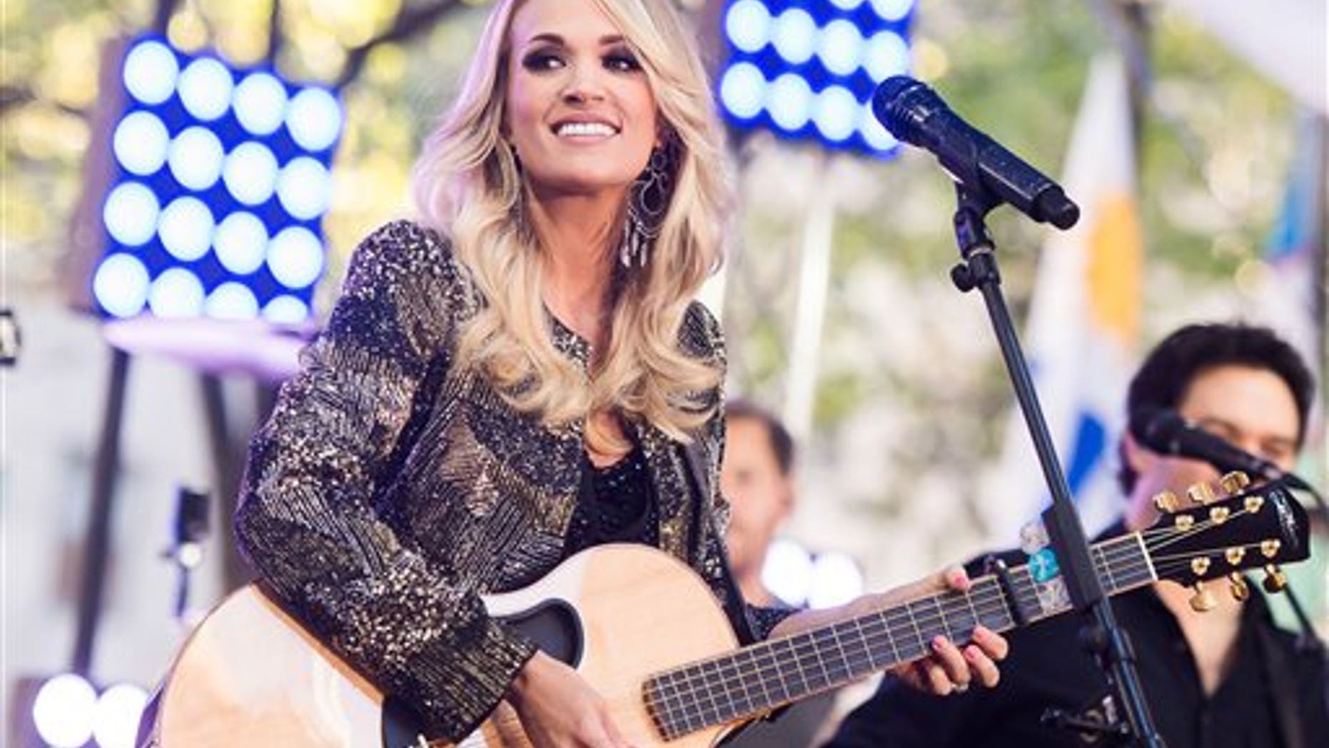 Carrie Underwood performs Friday in New York. (Photo by Charles Sykes/Invision/AP)