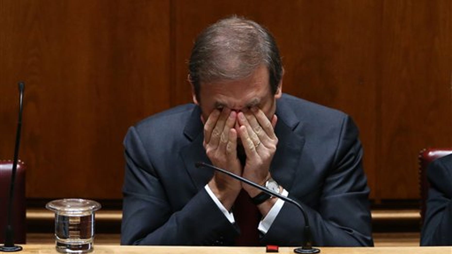 Portuguese Prime Minister Pedro Passos Coelho rubs his eyes during the debate Tuesday.