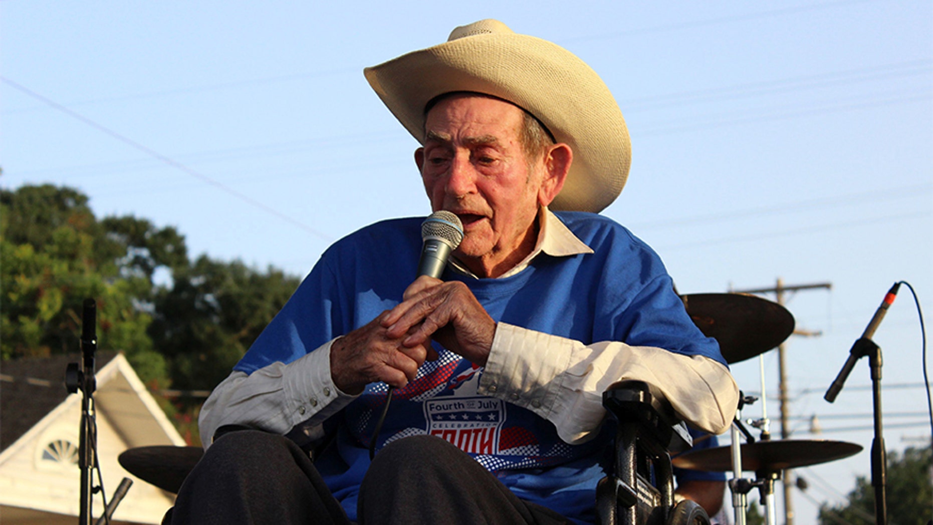 In this July 2, 2017, photo, Cajun musician D.L. Menard sings at a tribute to him in his home town in Erath, La. Menard, whose song "The Back Door" is among the most popular in Cajun music, is dead at the age of 85. Louisiana Funeral Services and Crematory in Broussard said on its website that Menard died Thursday, July 27 at his home in Scott, Louisiana. (Janet McConnaughey via AP)