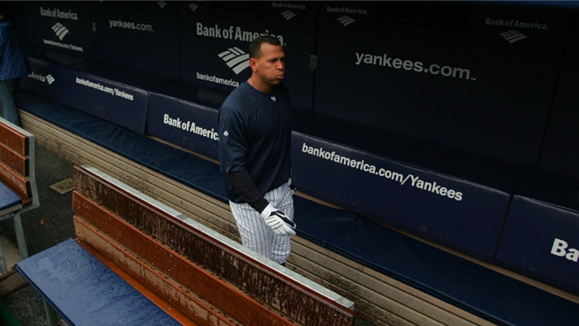 NEW YORK - OCTOBER 15: Alex Rodriguez #13 of the New York Yankees walks through the dugout during workouts on October 15, 2009 at Yankee Stadium in the Bronx borough of New York City. (Photo by Jared Wickerham/Getty Images)